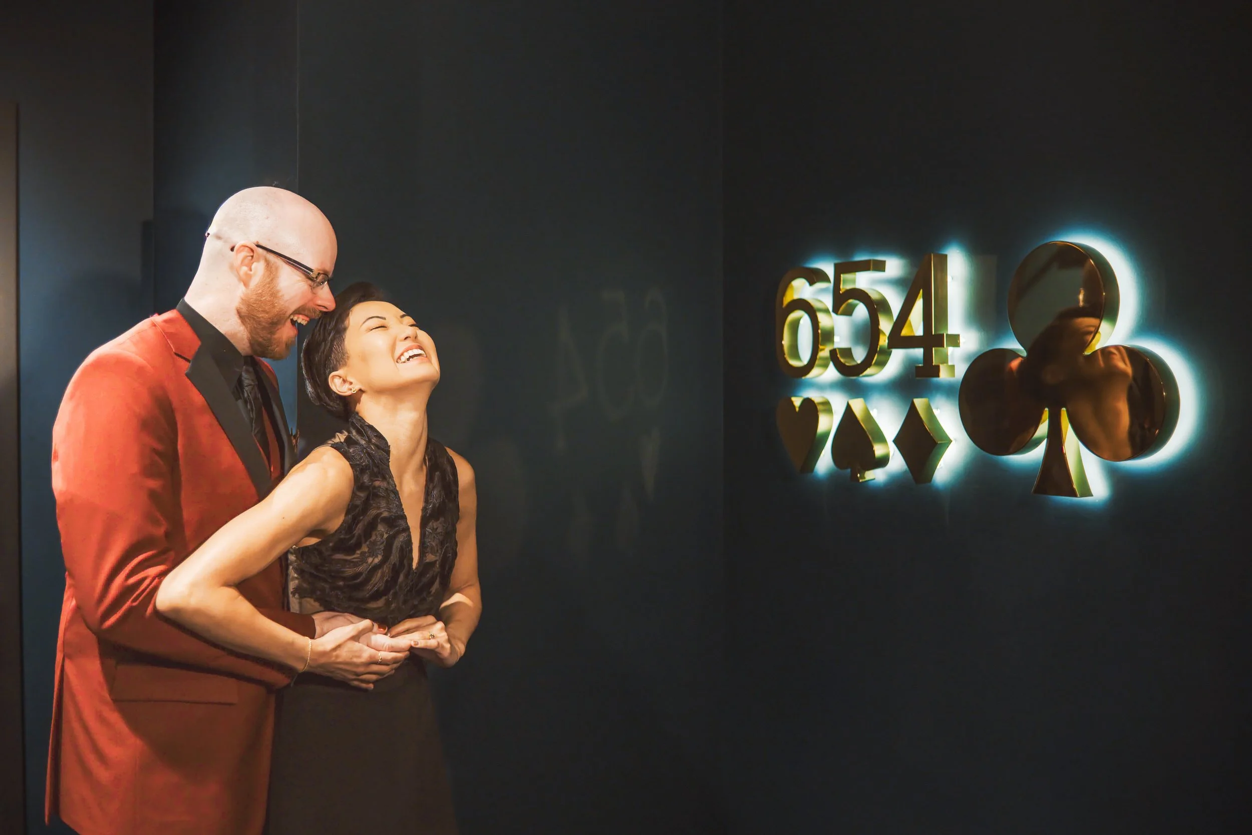 A candid moment between a bride and groom near the 654 club portion of the Chicago Magic Lounge in Chicago, Illinois.