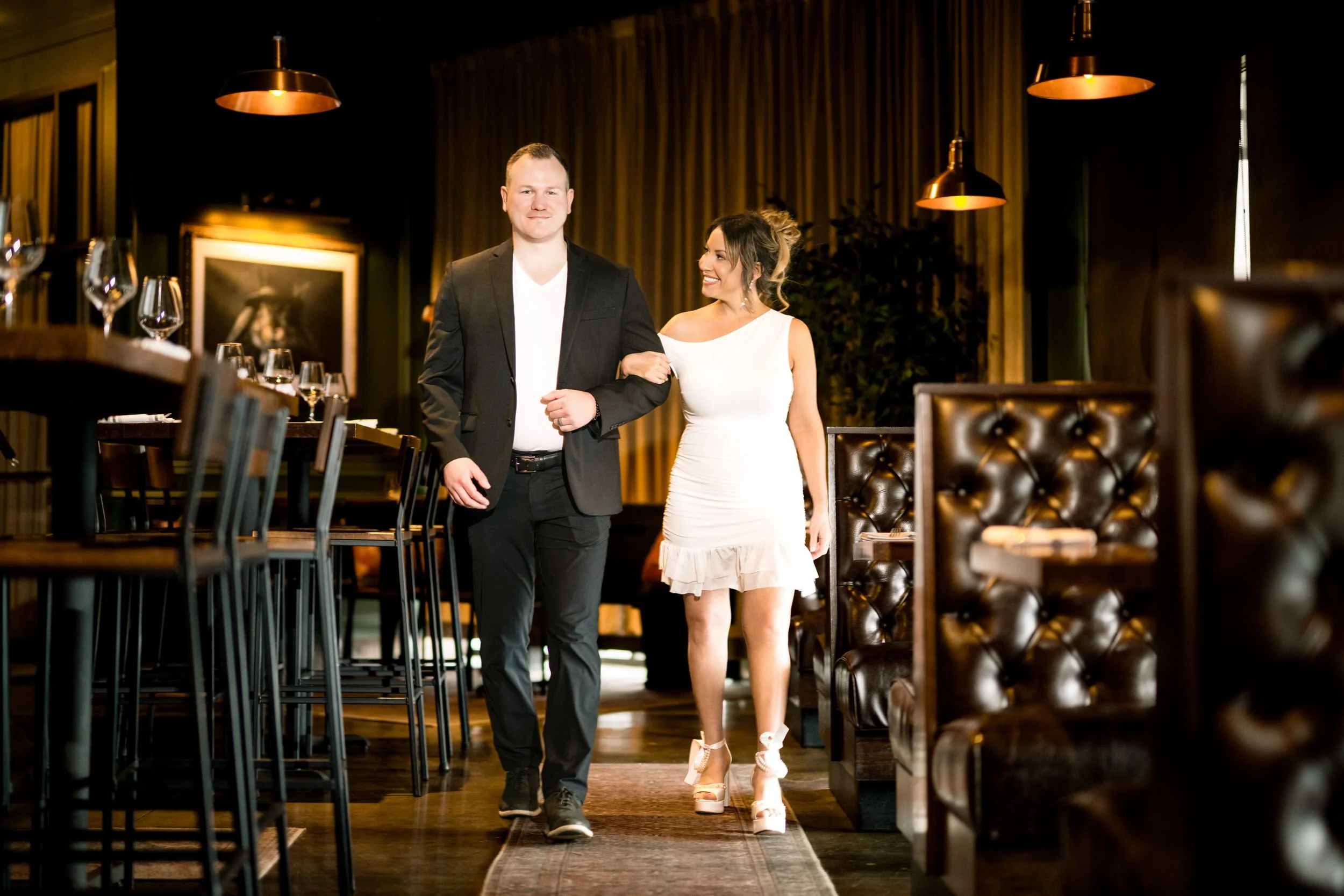 A couple walks along the wood furnishings at Lincoln and Wicker restaurant in Schererville, Indiana.