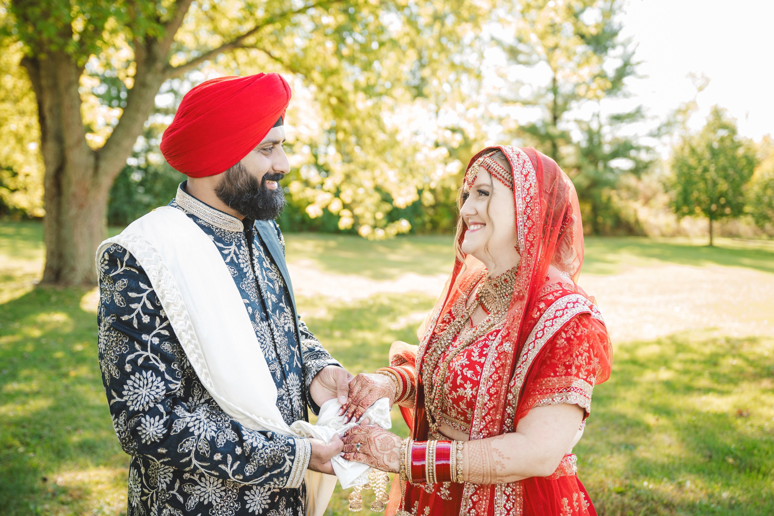 An Indian bride and groom are tied together after their ceremony.