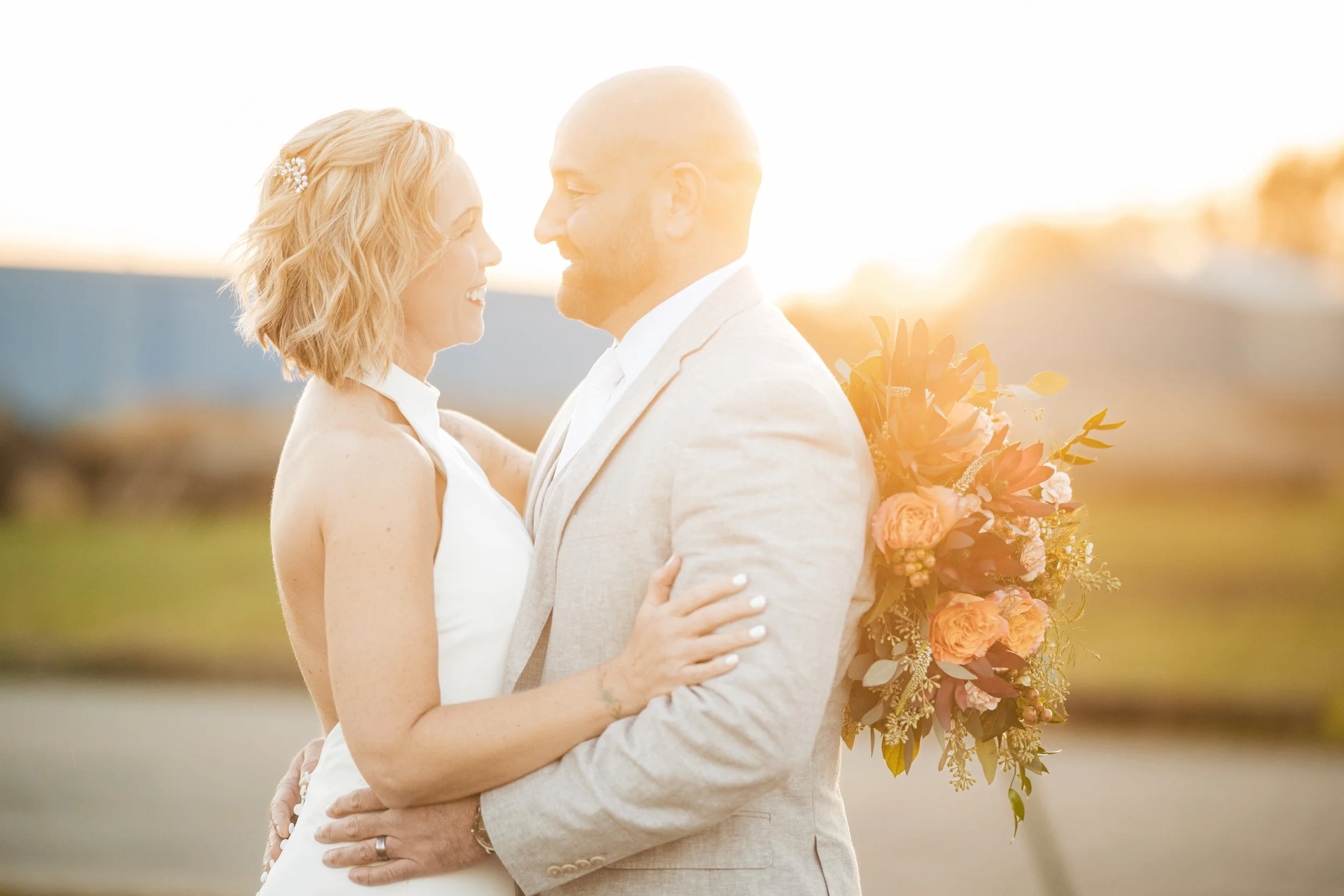 A golden hour wedding photo of a bride and groom at a micro wedding in southwest Michigan.