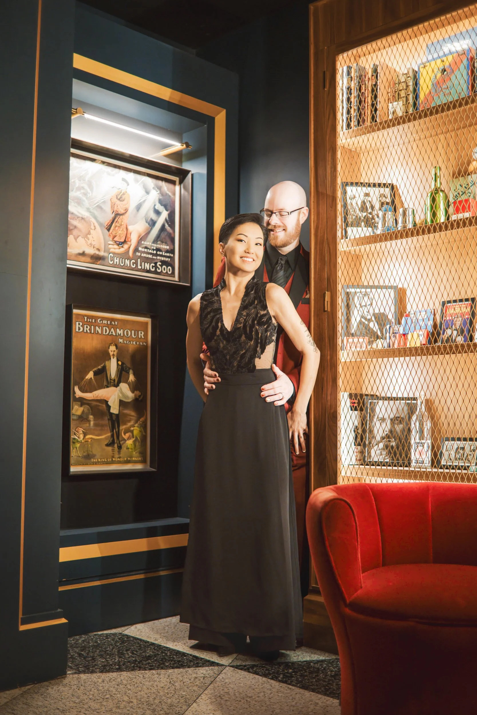 A bride and groom embrace at the entrance of the Chicago Magic Lounge.
