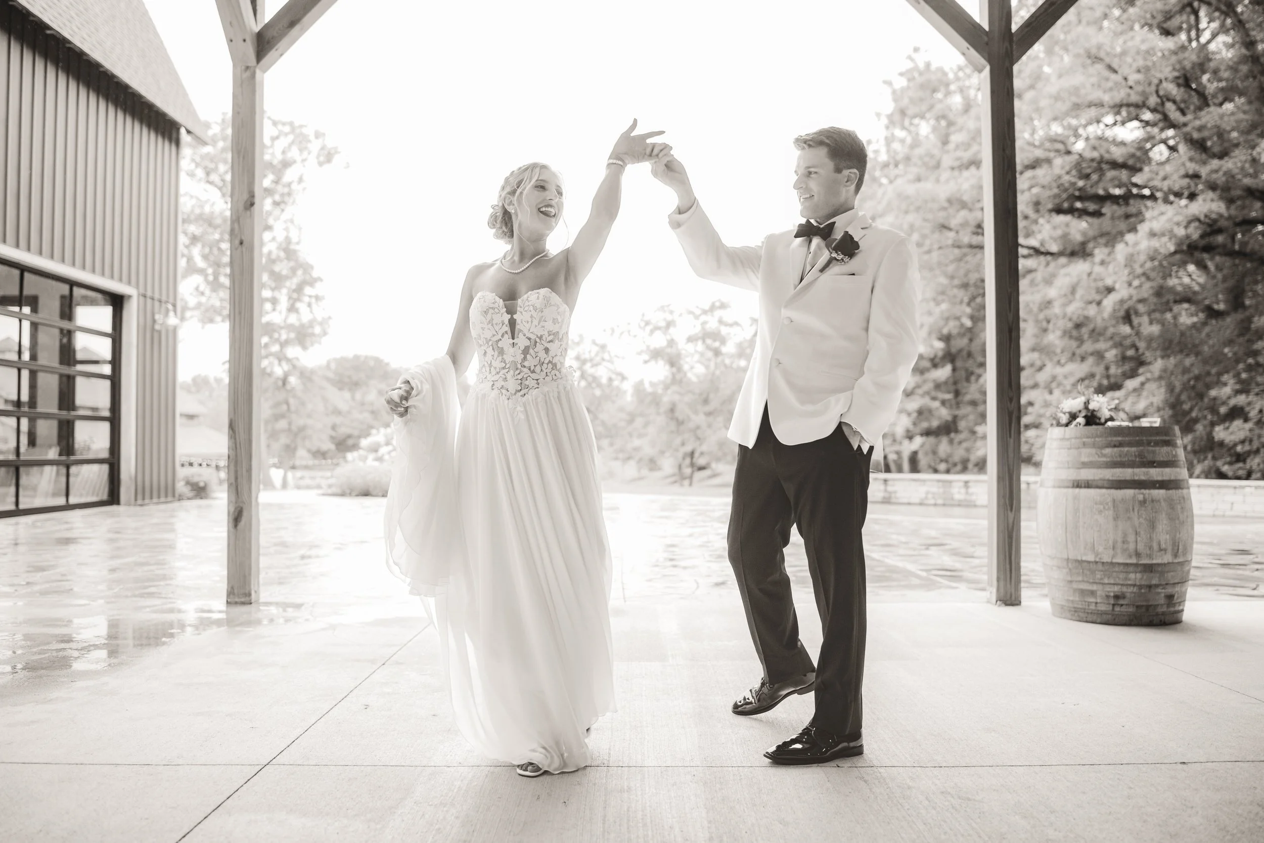 The groom spins his bride at White Oak Farm in Michigan City, Indiana.
