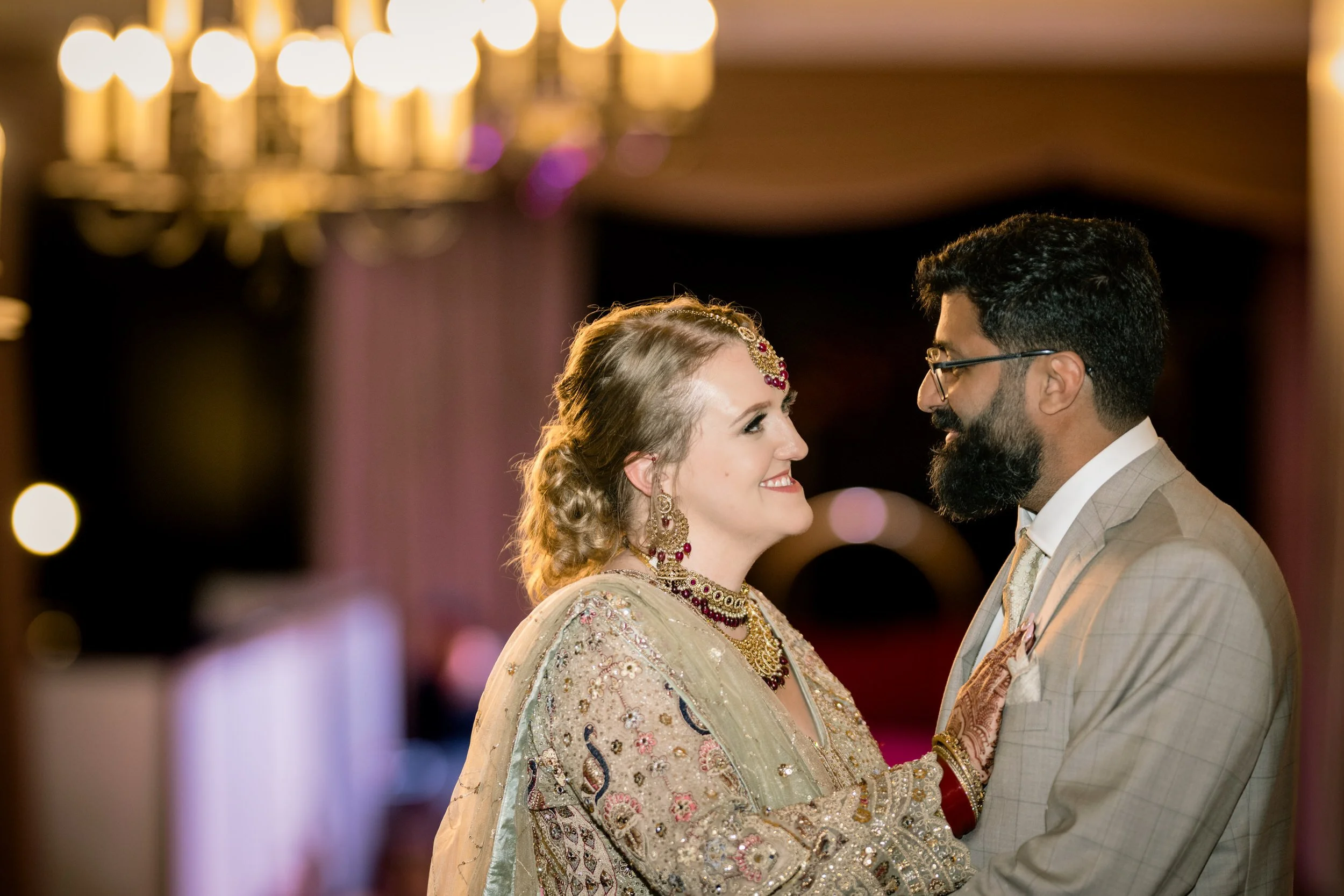 The bride and groom look into each other's eyes during wedding portraits at Duncan Hall in Lafayette, Indiana.
