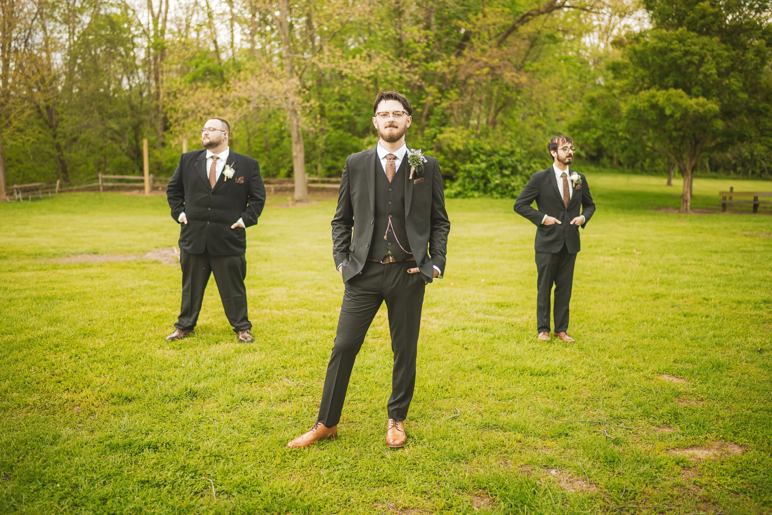 The groom and his groomsmen stand in a field in Merrillville, Indiana's iconic Deep River County Park.