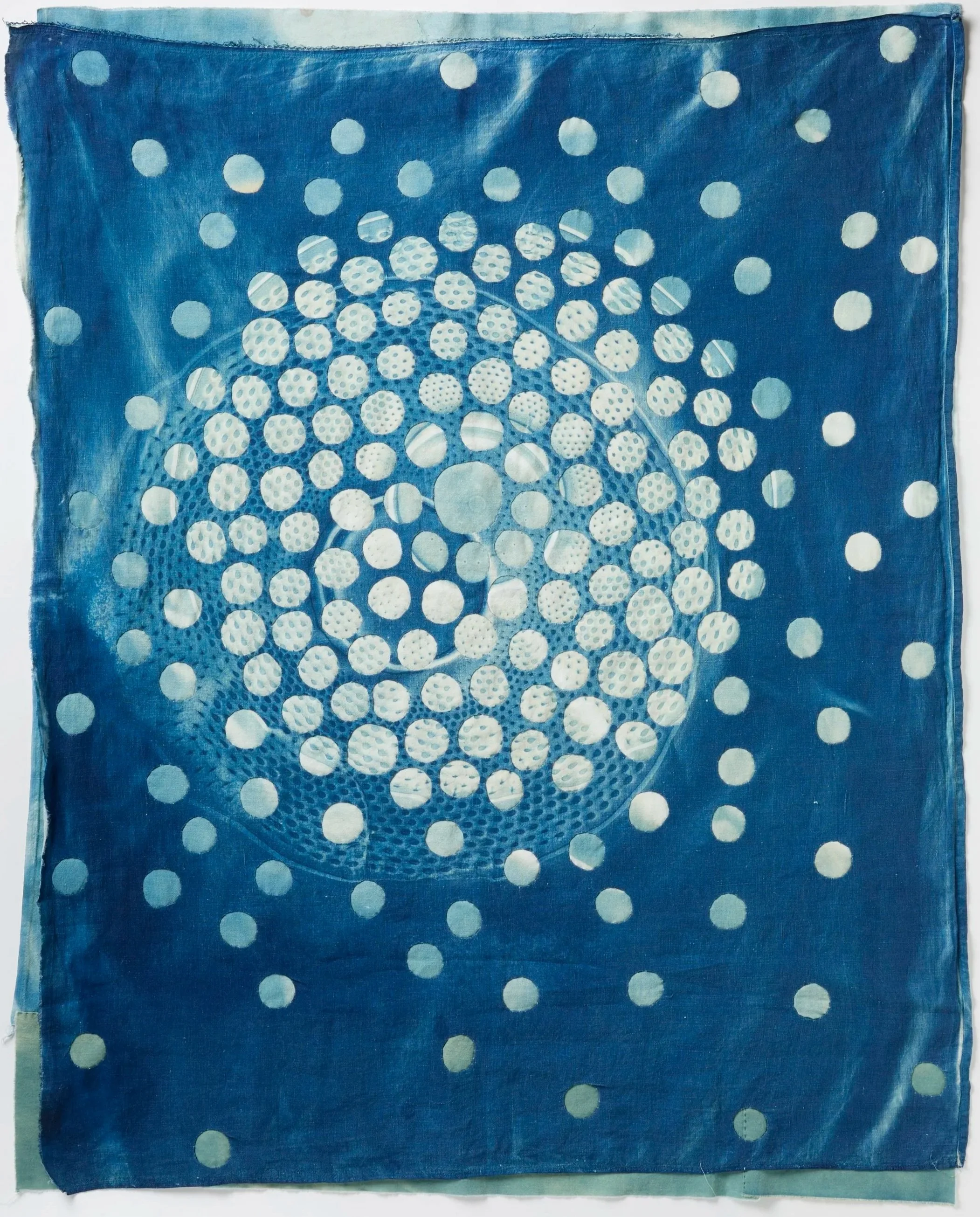   Concentric Circles: Wind Rose   2026   Cyanotype and bleached cyanotype on upcycled cotton   36" H x 29" W   Photo:  Clarissa Bonet     
