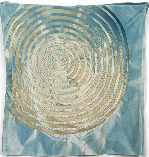   Concentric Circles: High Water Mark   2026  Cyanotype and bleached cyanotype on repurposed cotton  Approximately 28” H x 27” W   Photo:  Guy Nicol   