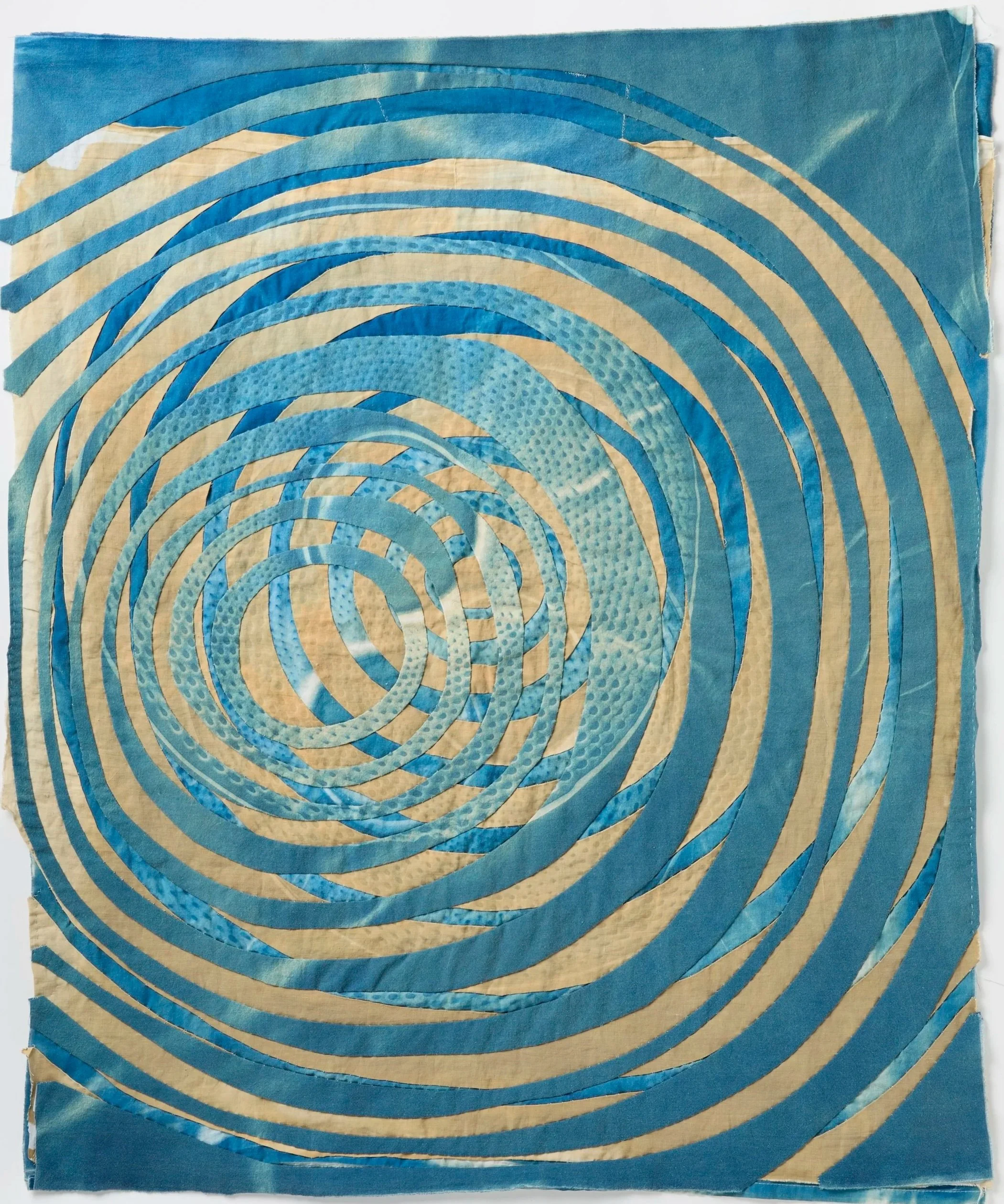   Concentric Circles: Fluid Dynamics   2026  Cyanotype and bleached cyanotype on upcycled linen and cotton  33" H x 29" W   Photo:  Clarissa Bonet 