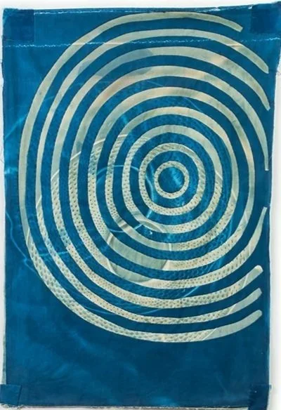   Concentric Circles: Ripple Effect   2026  Cyanotype and bleached cyanotype on upcycled cotton  Approximately 31" H x 22" W   Photo : Clarissa Bonet   