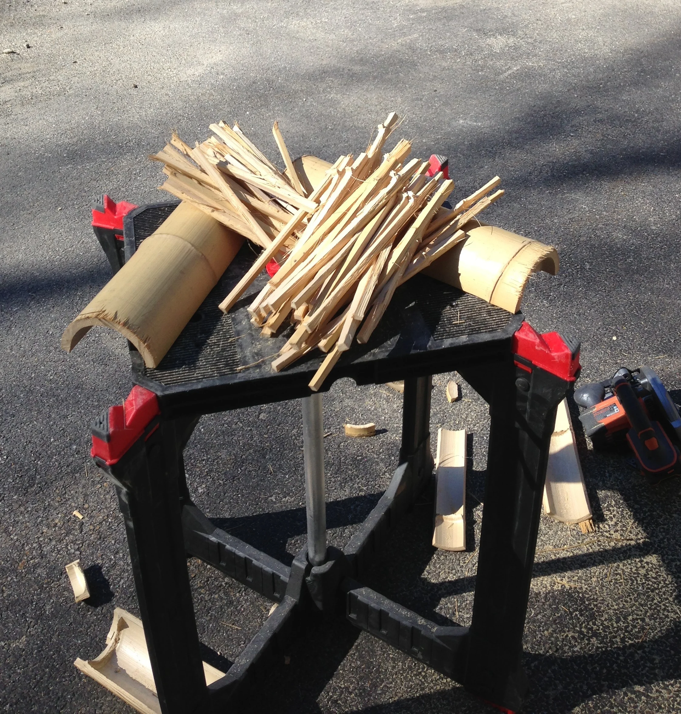 Chopstick "blanks" before processing on top of pieces of the original canes they came from.