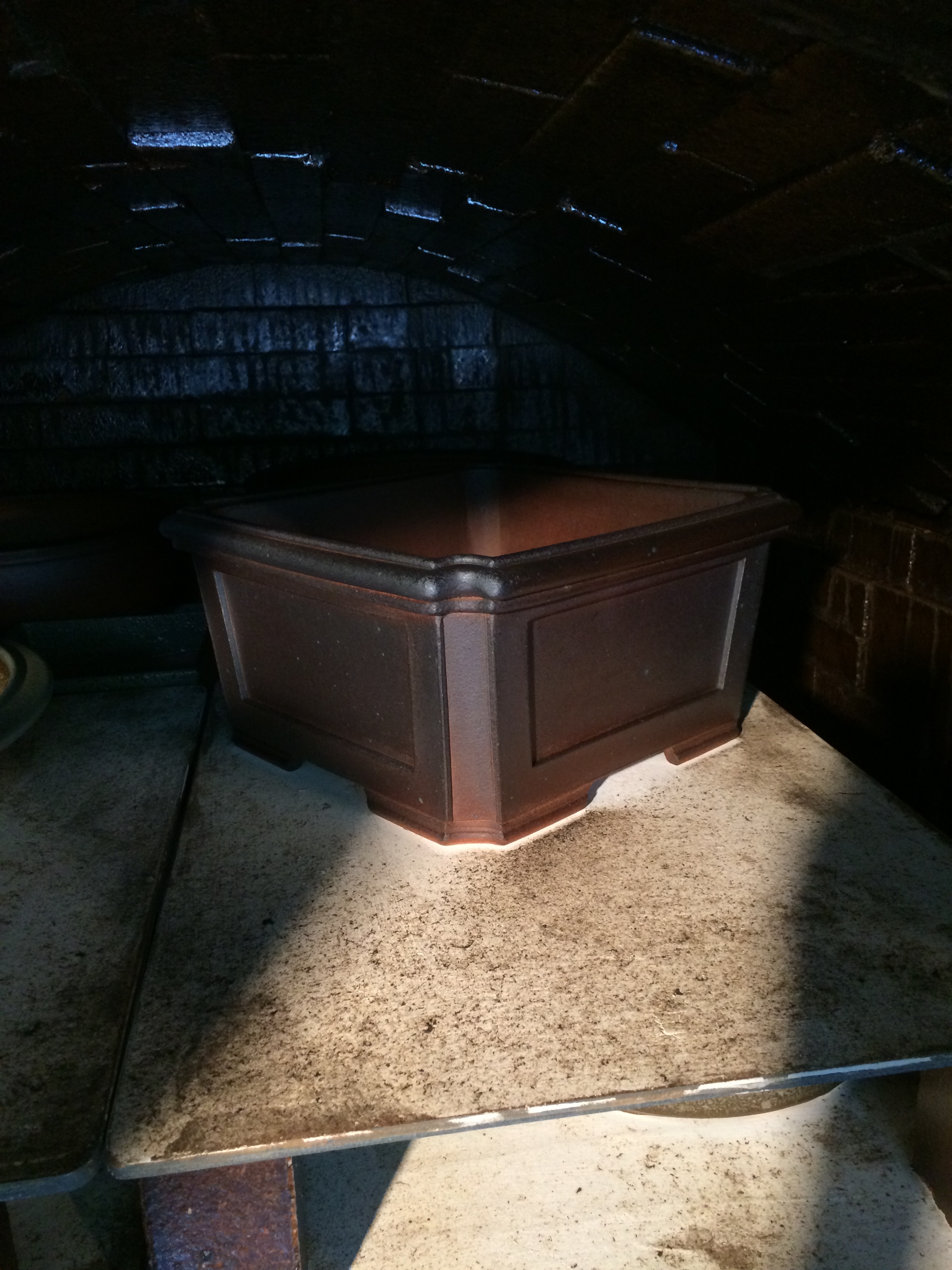 You can see how much the pot shrank in firing from the "footprint" of unburned shelf around the feet.