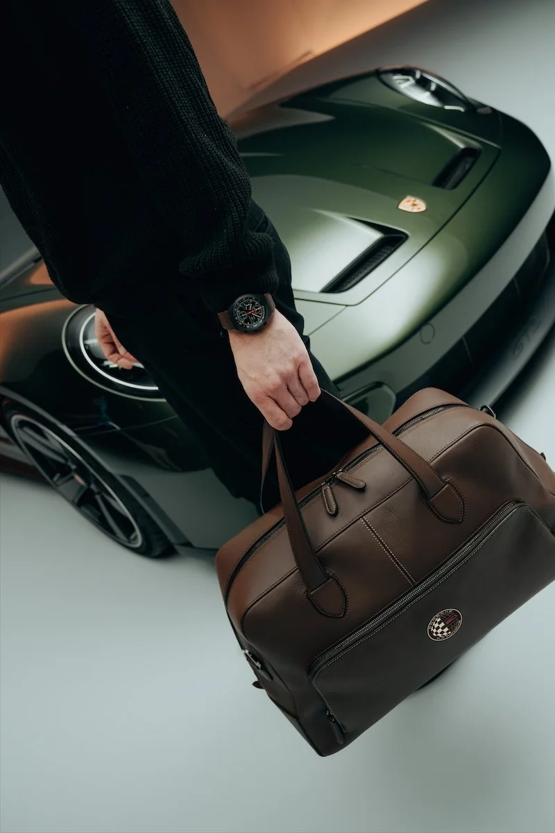 Introducing: Porsche Design Chronograph 1 ‘90 F.A. Porsche’ Edition. Alongside a 911 GT3 90 F.A. Porsche, a Sled, and Weekender Bag.
