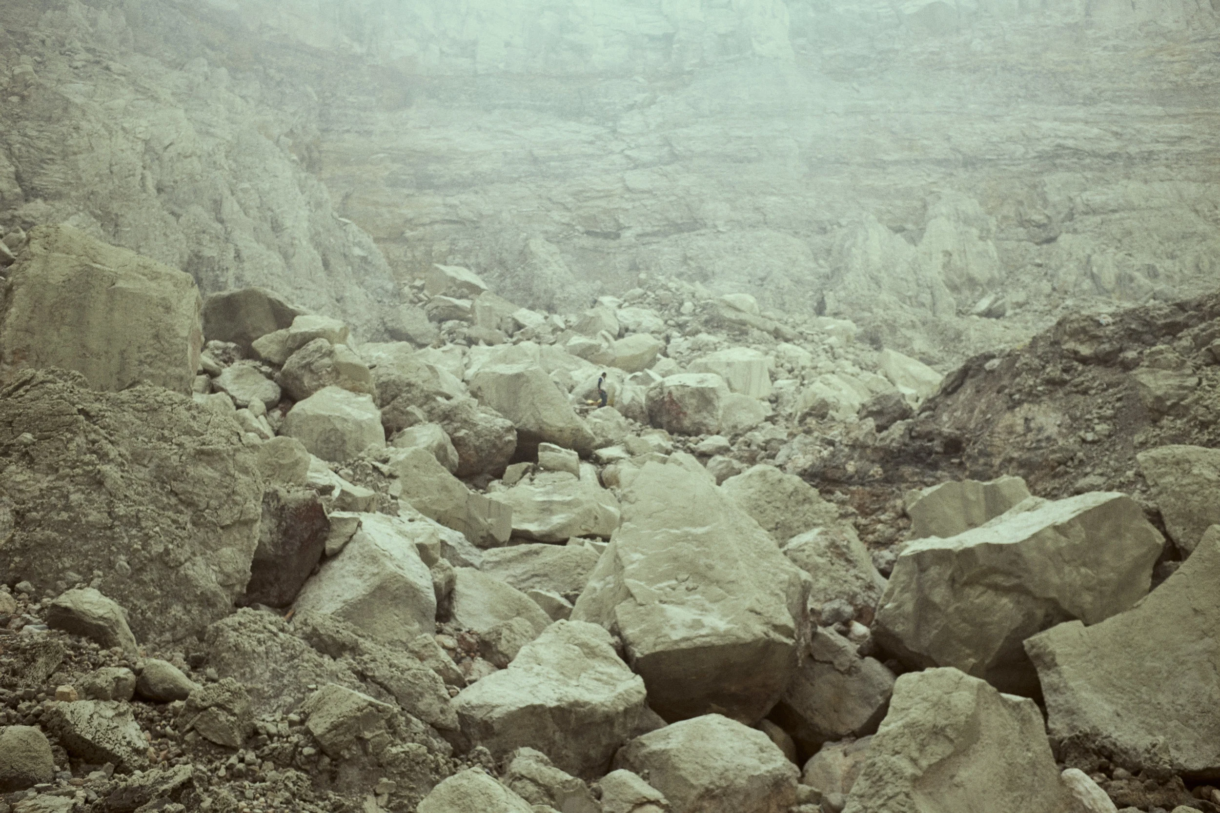 Local men supplement their farming by extracting and carrying sulphur. Ijen Crater, Java, Indonesia. Ijen is mined for sulphur. ©Laurence Gibson