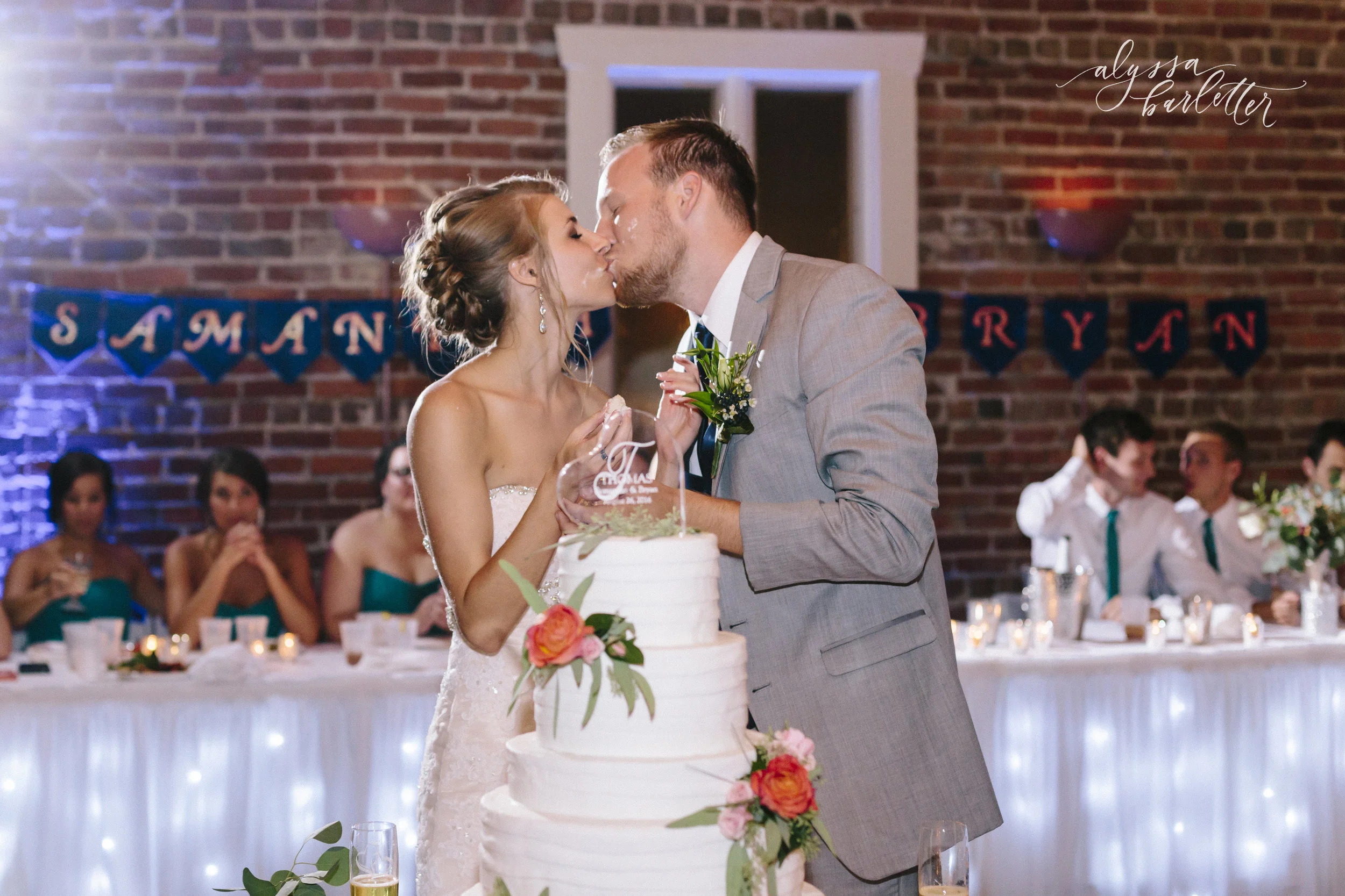 kansas city wedding photographer westport californos reception bride groom cake kiss