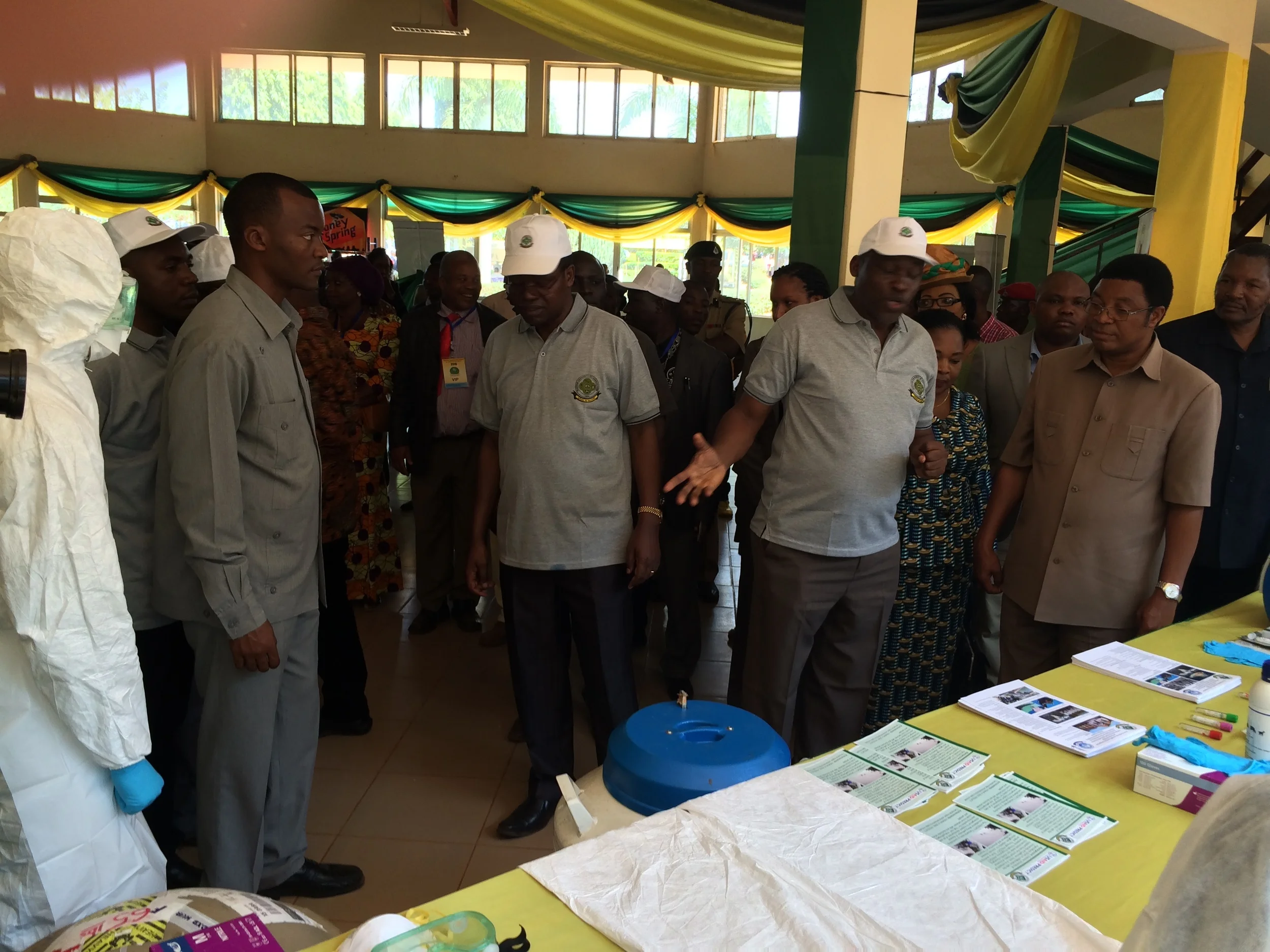 Above & Below: Professor Kazwala is at the PREDICT table explaining to the Prime Minister (Kassim Majaliwa) what PREDICT is all about, and to the left of Prof is the Sokoine University of Agriculture Vice Chancellor. 