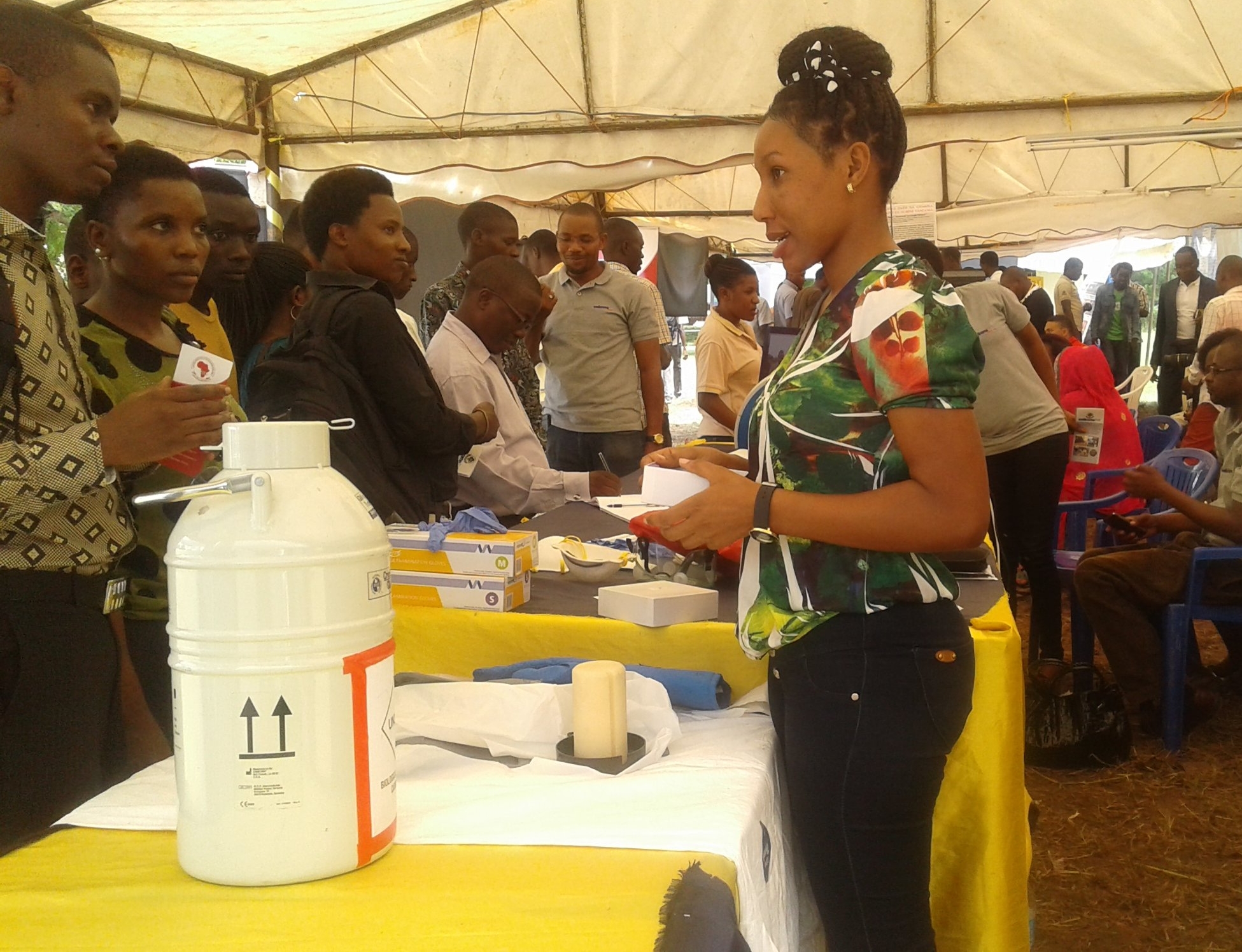 ISMERALDA FRANCIS (PREDICT Volunteer) demonstrating the project activitie in the field and in lab.