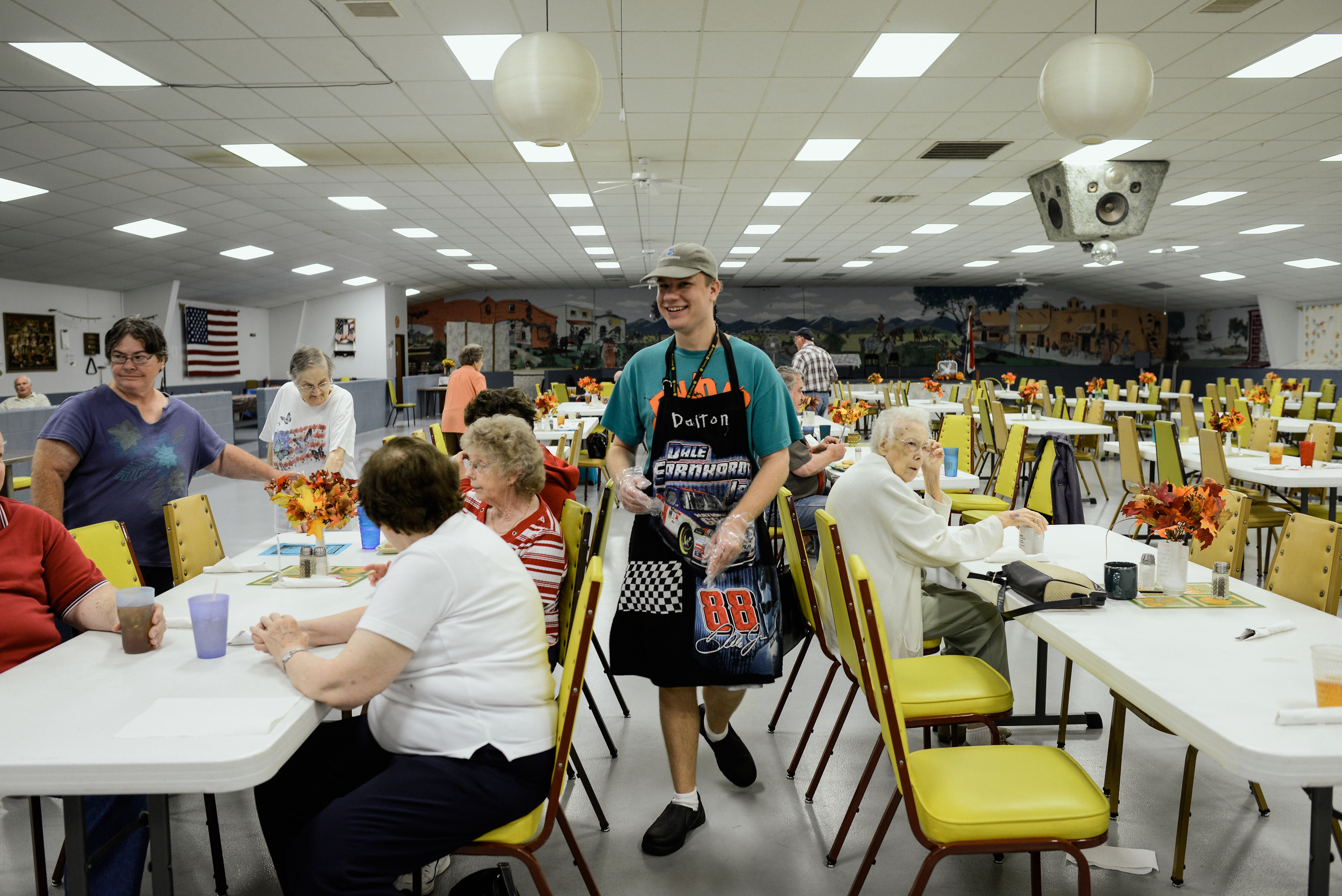  Trenton, Missouri. 2013.  Dalton helps serve lunch at the local senior center. He volunteers multiple times a week because he enjoys interacting with different members of the community. 