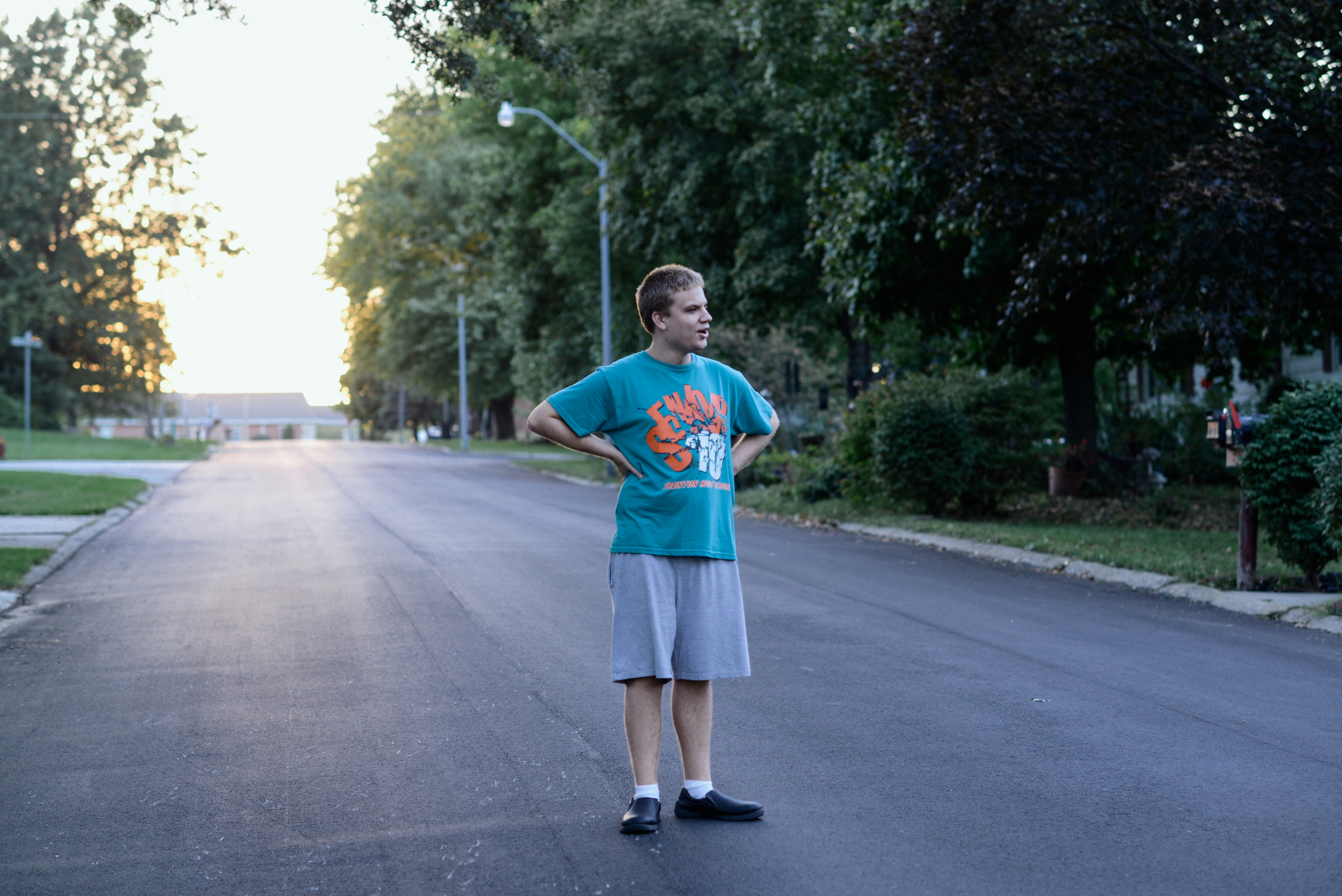  Trenton, Missouri. 2013.  Out on a walk near his home, Dalton visits with neighbors to talk sports and exchange trading cards. 