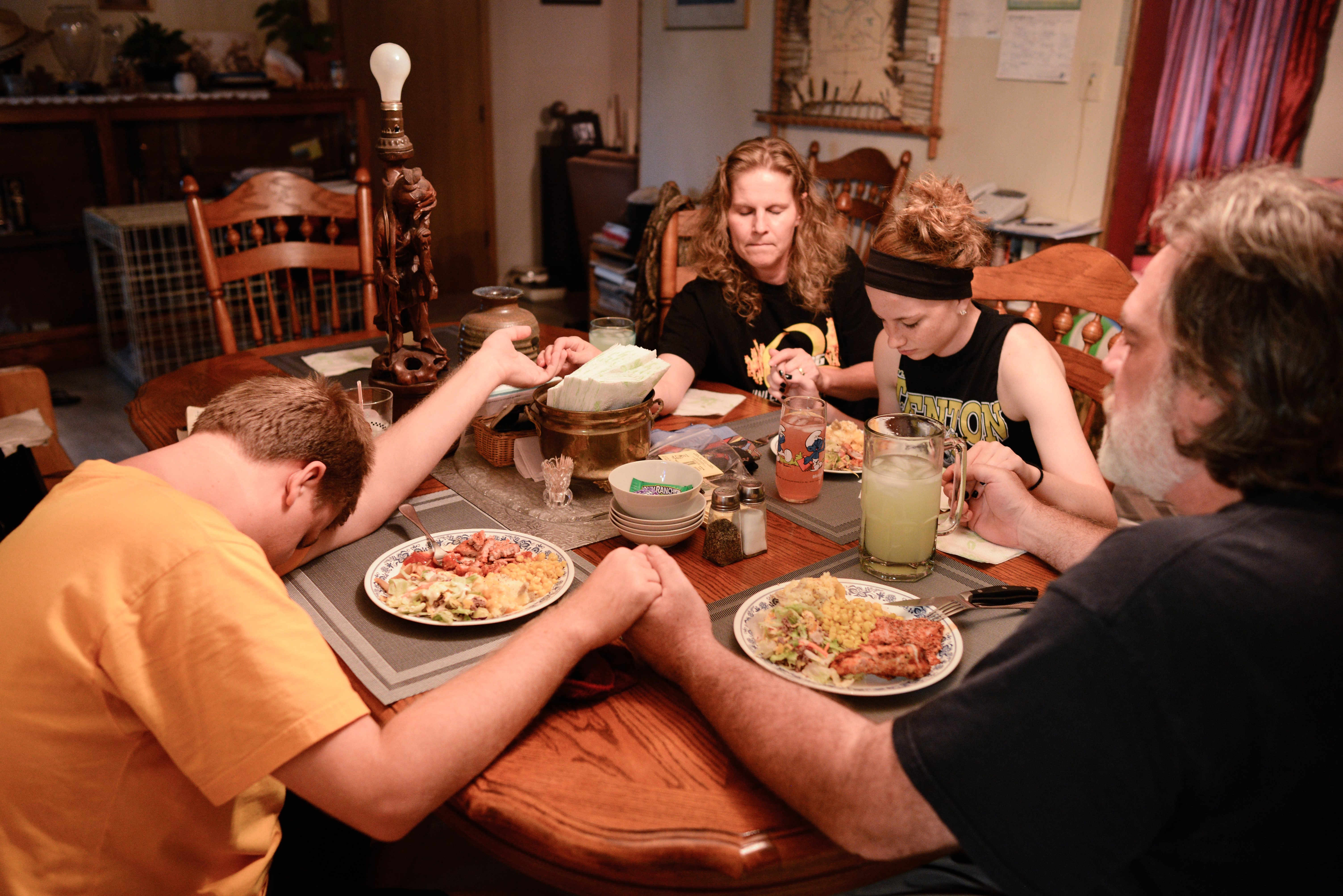  Trenton, Missouri. 2013.  The Trask family says grace before dinner. 