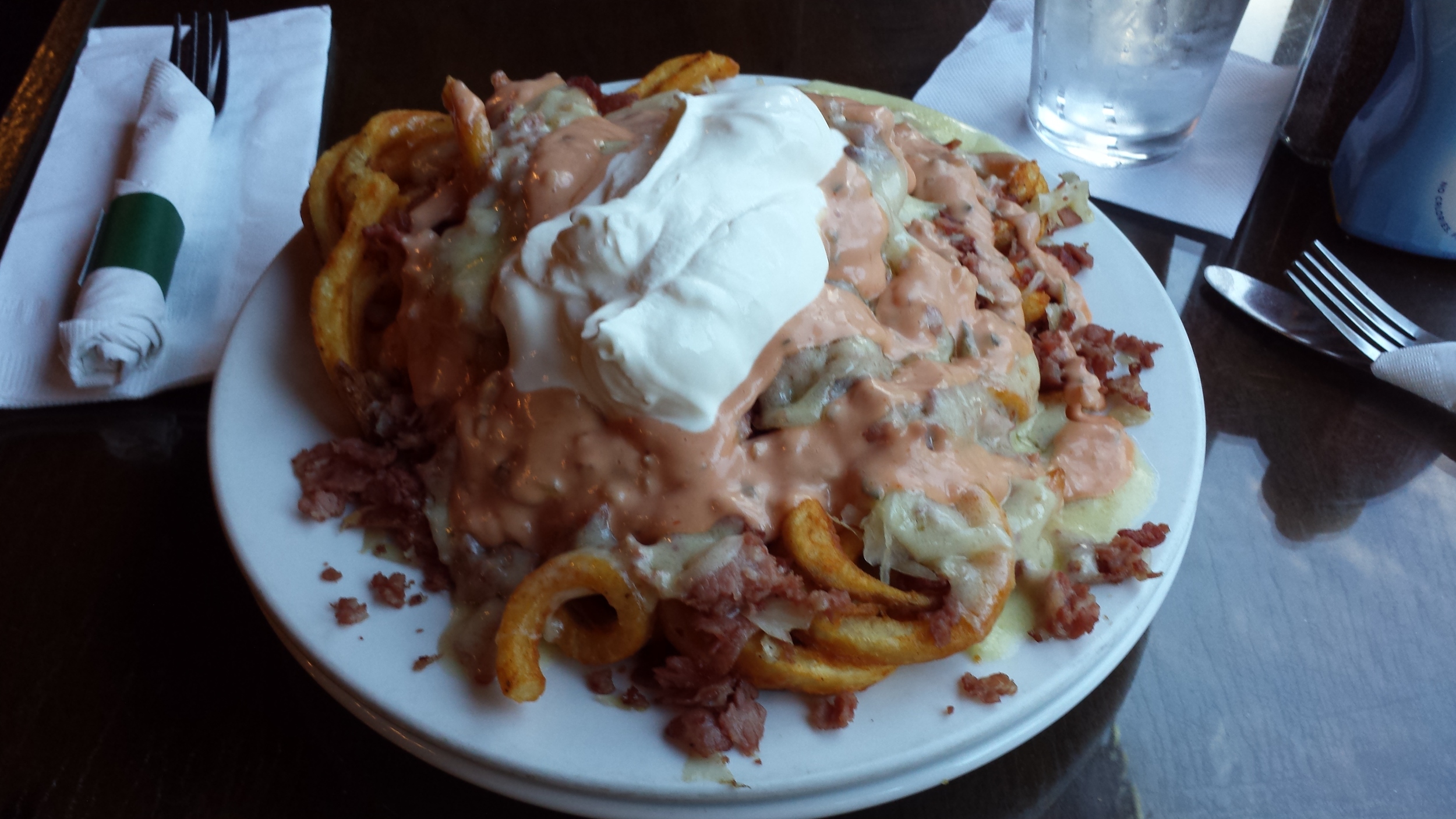 Seasoned Curly Fries, Corned Beef, Swiss Cheese, Sour Cream, Thousand Island Dressing, Sauerkraut