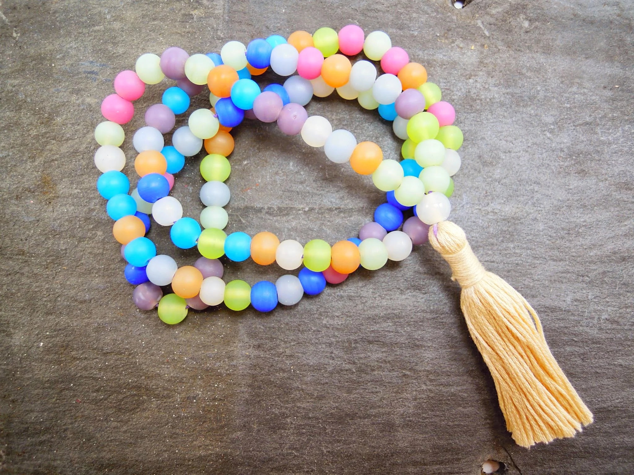 Spring Eternal Mala with handmade tassel. This mala is strung on stretchy cord so you can easily wrap it around your wrist.