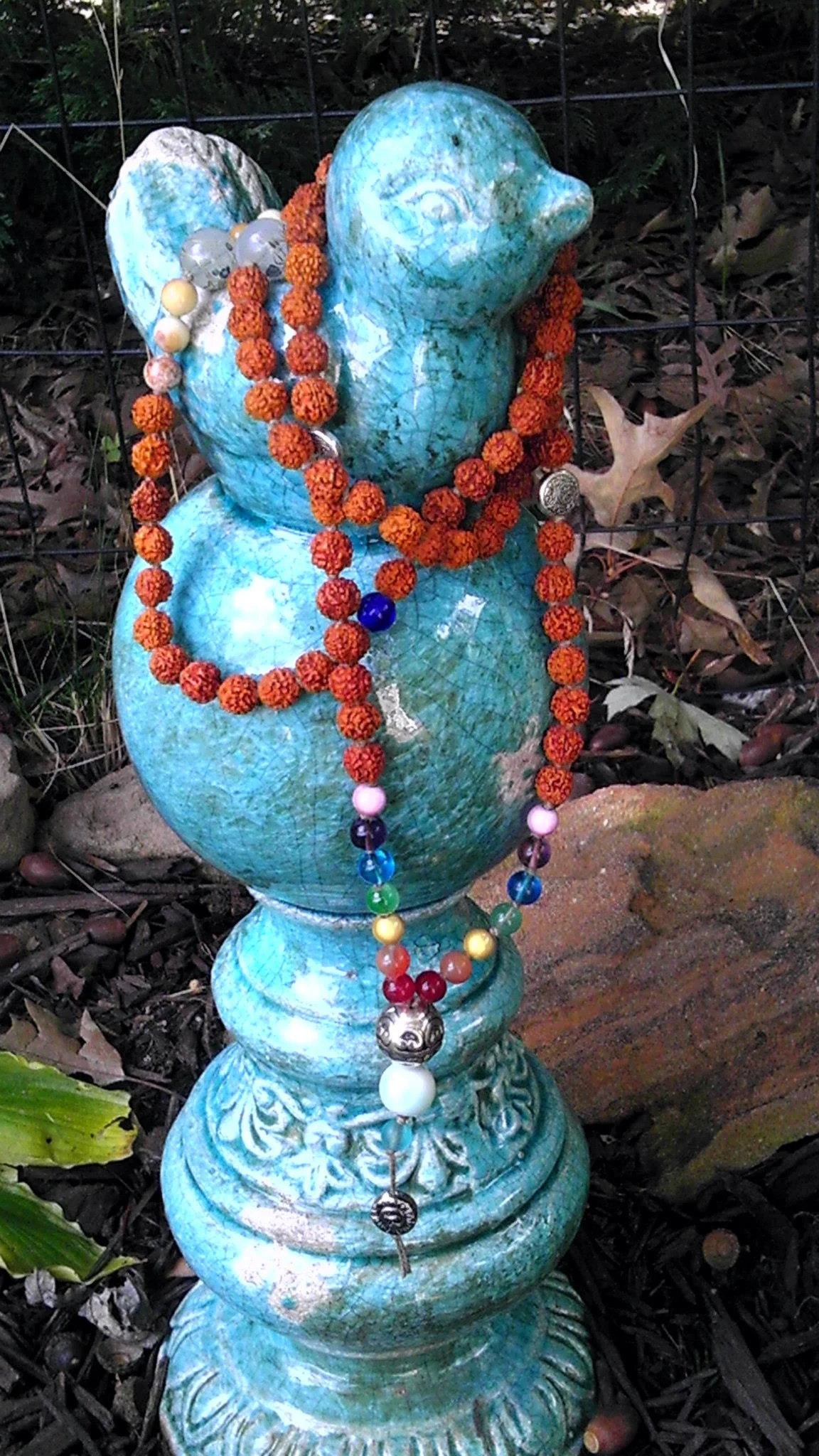 Chakra Balance Mala with Rudraksha...this is a custom made mala I made a couple of years ago. This picture is from one of my shade gardens.