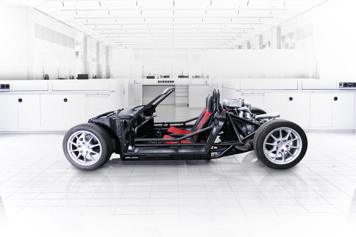 The custom, removable body, inspired by the original aesthetic of the car was fabricated using hand formed steel. Infusing lightweight, technologically advanced components with classic German design has created a modern sports car that embodies the spirit of its track focused predecessors.