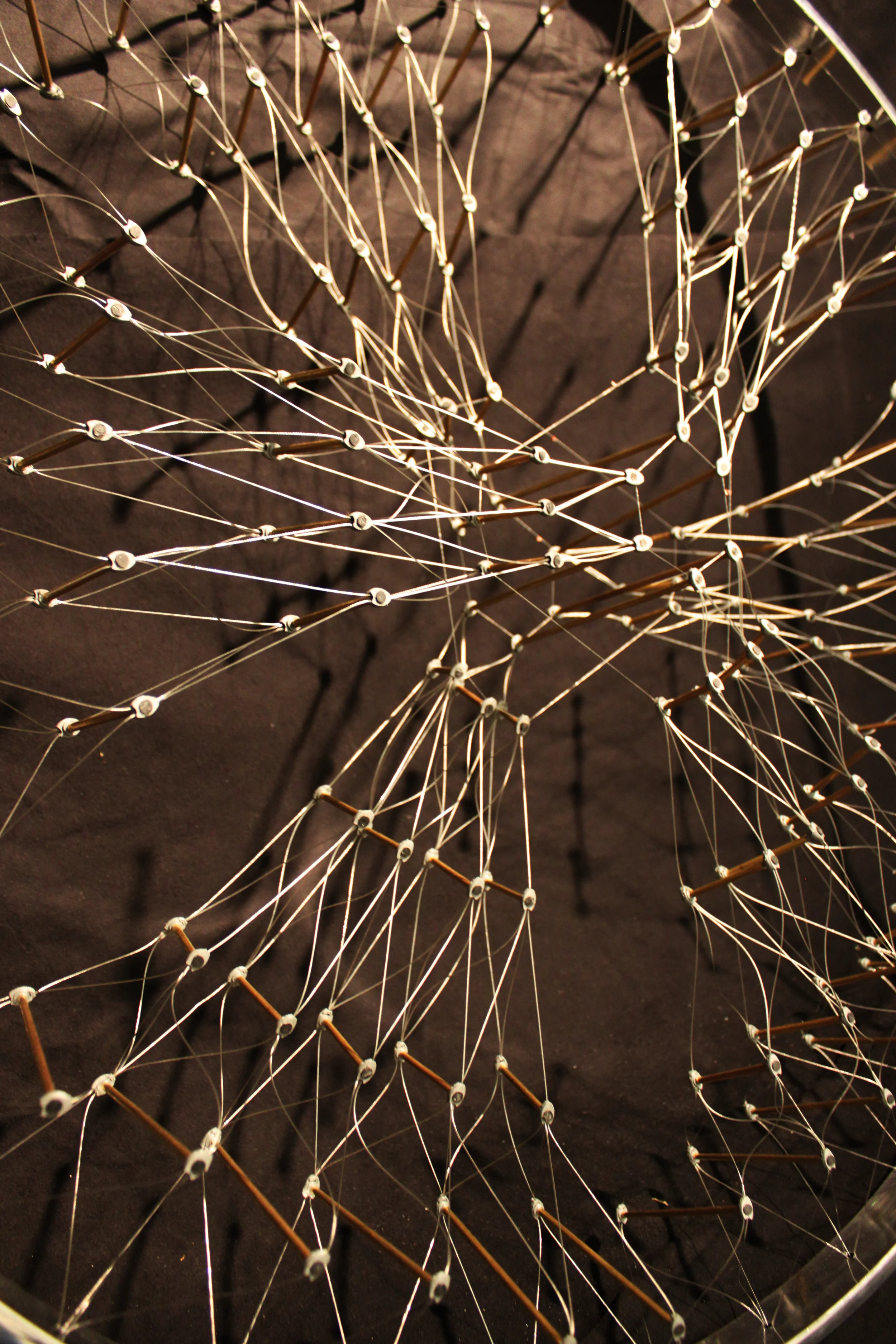  Steel cables are anchored to custom 3D printed components that tie the tensioning &nbsp;members to copper compression tubes. 