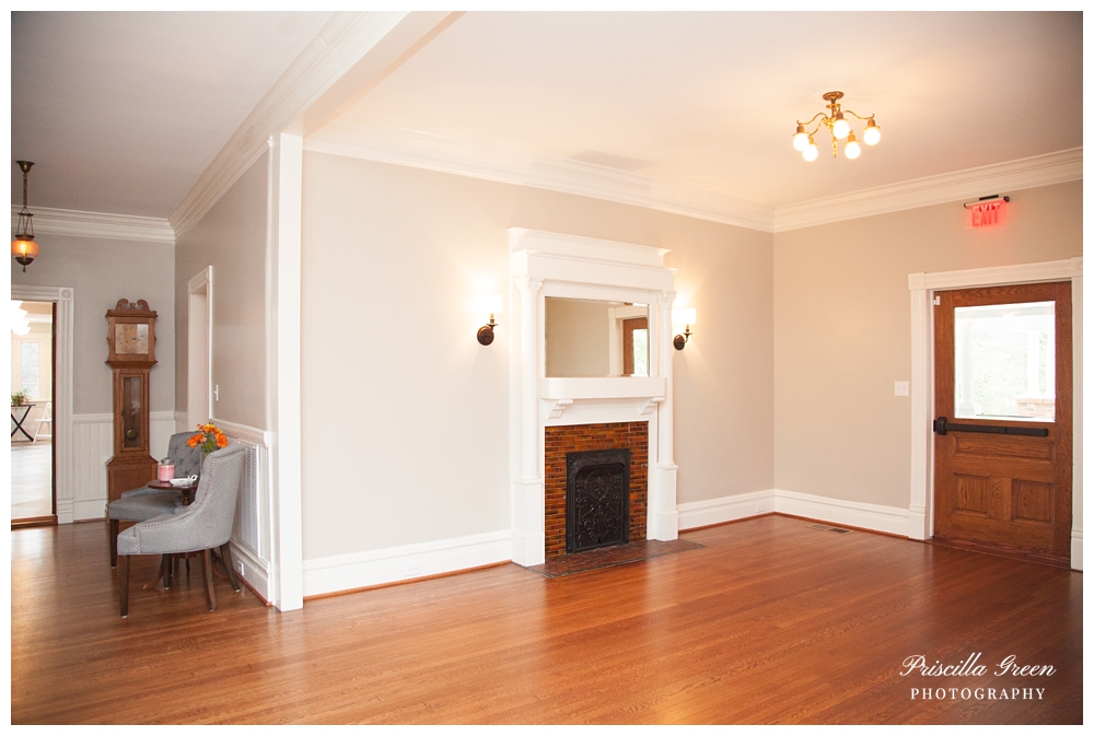 To the right is an empty room perfect for reception seating or bar.