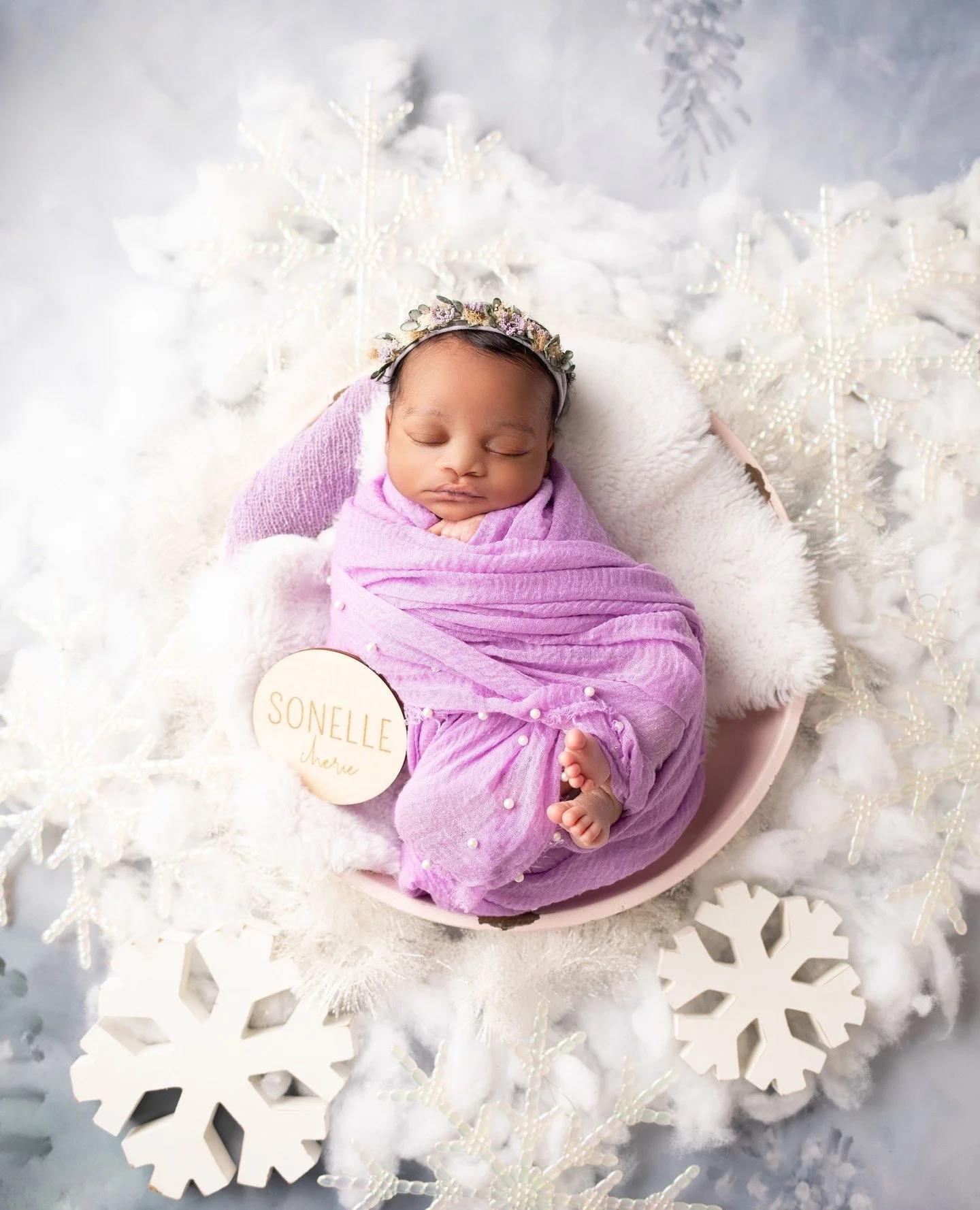 Wrapped in purple, surrounded by snowflakes, and completely unbothered by the cold ❄️💜⁠
⁠
This winter gave us a little extra magic &mdash; soft snow, cozy sessions, and babies who somehow make even the chilliest setups feel warm. We soaked it up, le