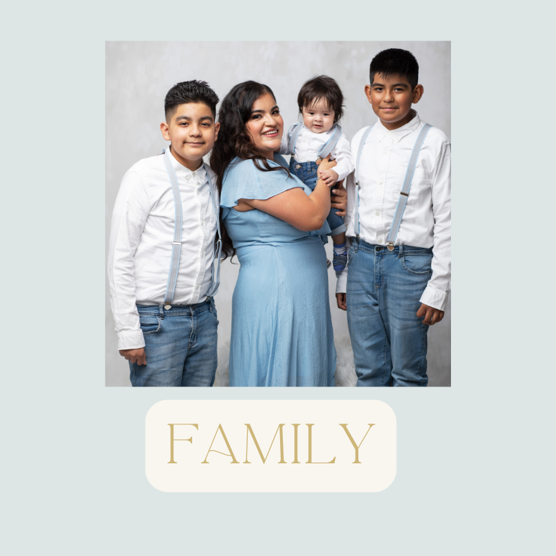 A woman with three young children, two boys and a baby girl, all dressed in coordinated clothing, smiling for a family portrait against a light background, with the word "FAMILY" written below.