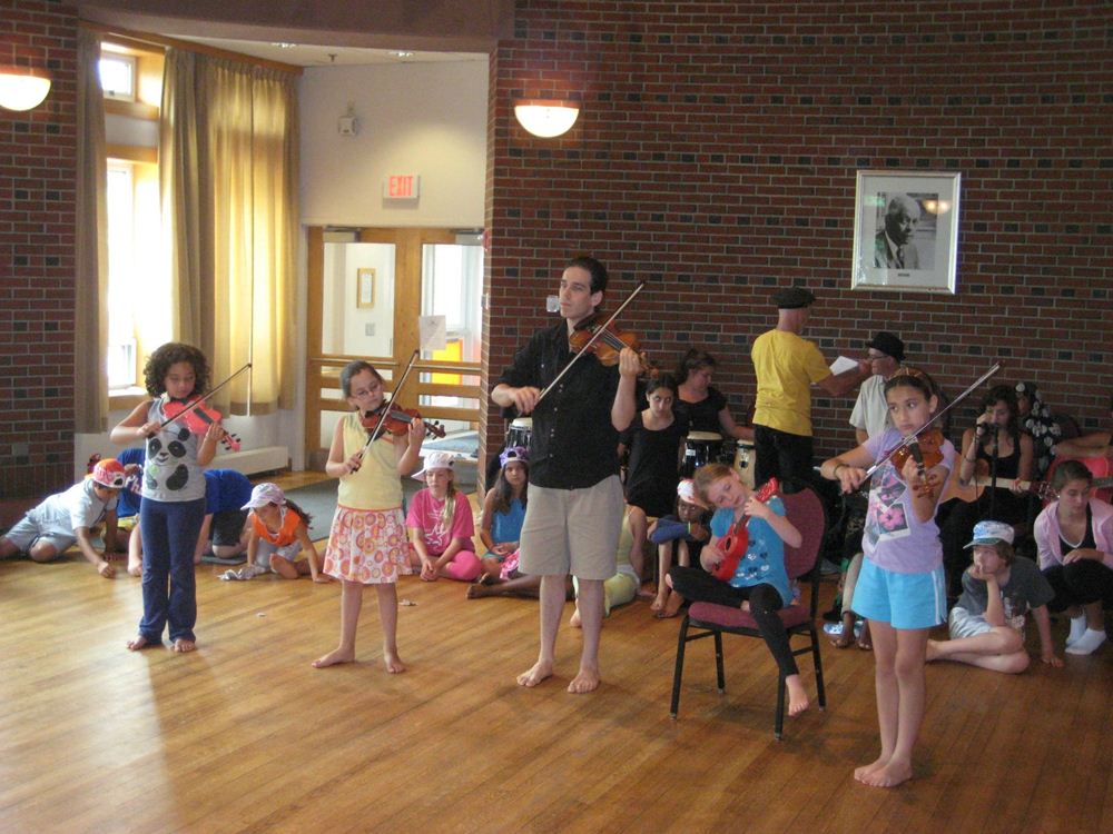 From last year's camp: leading a small string ensemble, rehearsing for the Bates Finale Concert!