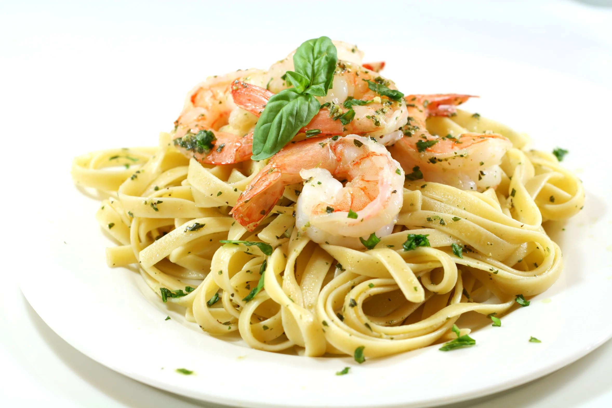 SHRIMP FETTUCCINE ALFREDO Tossed in a Creamy Parmesan Butter Sauce.