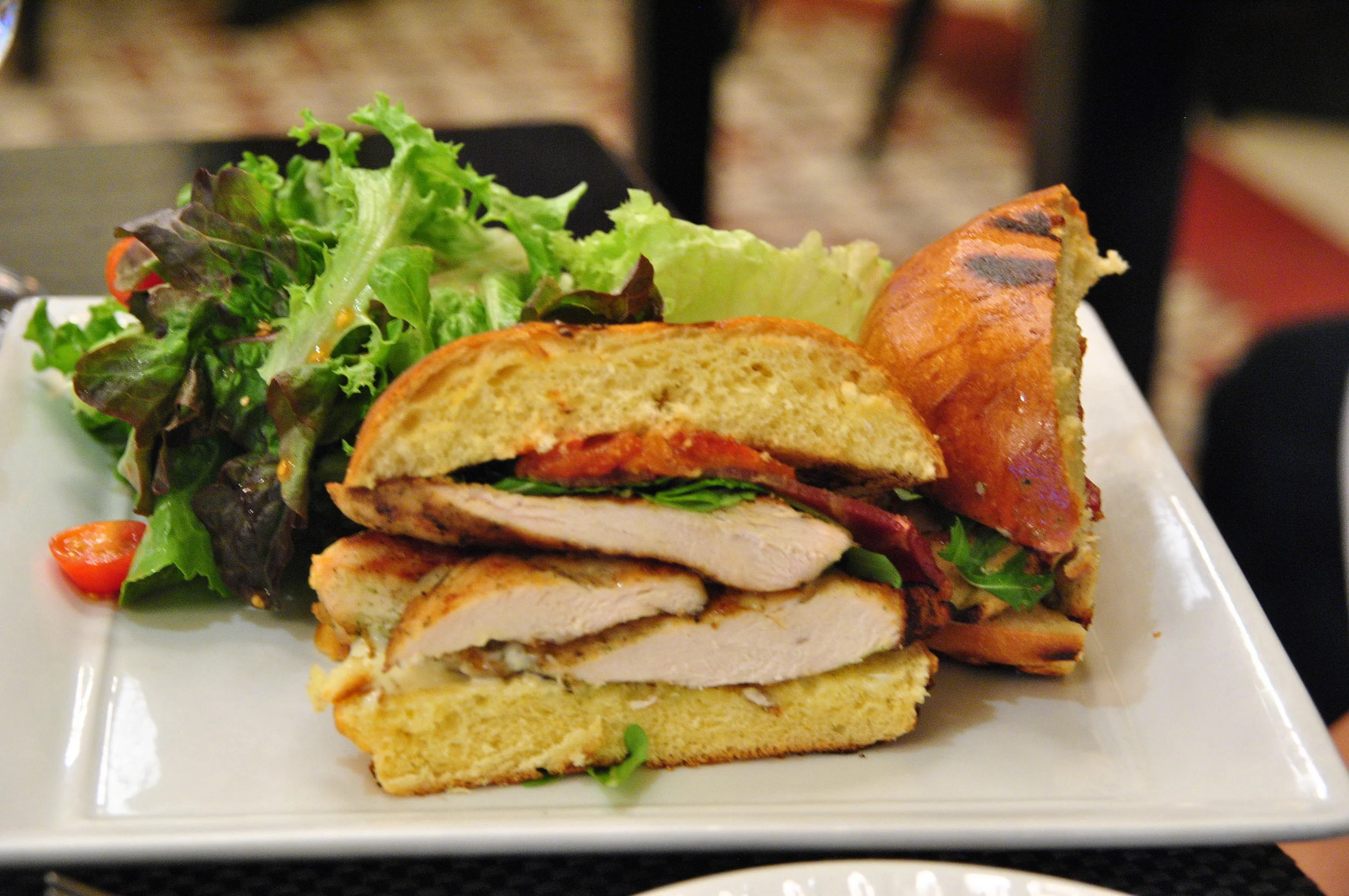 GRILLED CHICKEN BREAST SANDWICH Lettuce, Tomato, Bacon & Cheese.