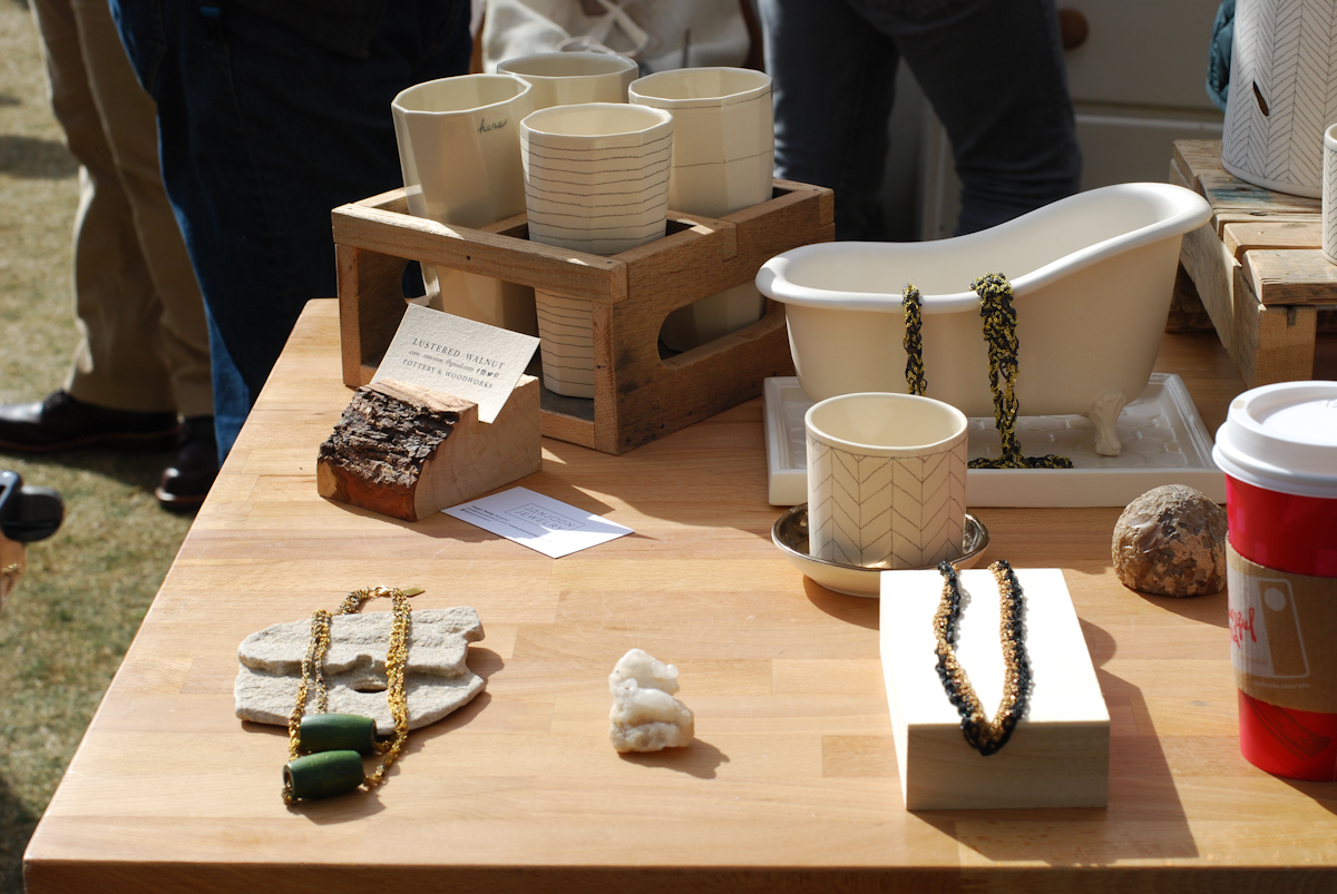 This display by Lusuterd Walnut and Janjoon Jewelry uses negative space to better highlight products.