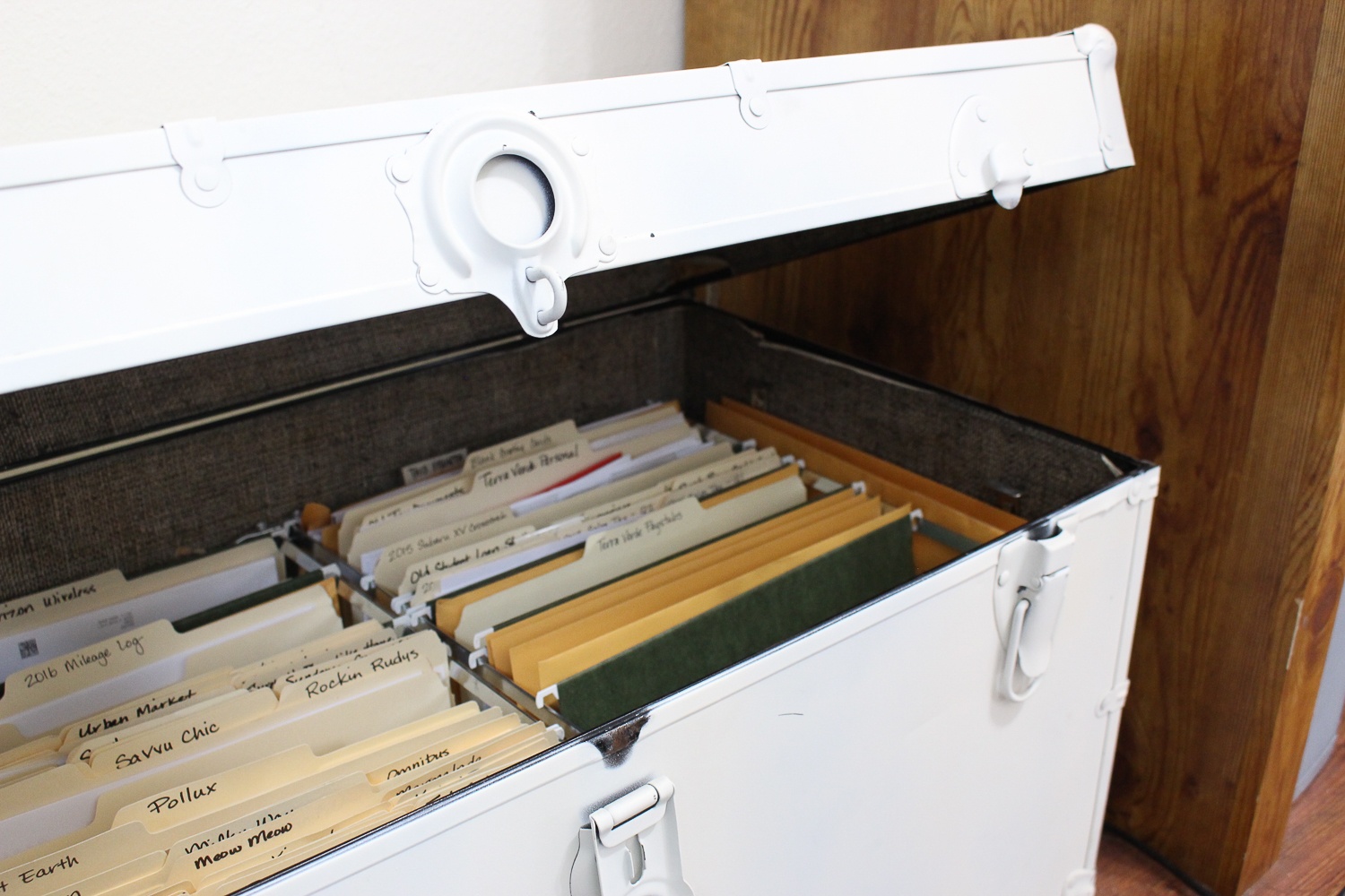 I completely stole this idea from Pinterest, but I’ve owned this trunk since I was about 8 years old and it wasn’t beingused for anything else anywhere in the house, so I bought some of those metal hanging file inserts and made it into myfile drawer.
