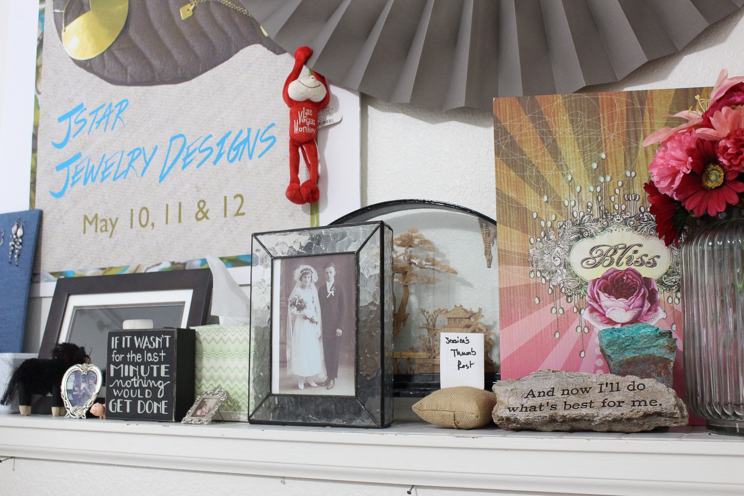 My studio can’t just be all work and no play, so I use this odd built-in ledge to display some fun knick-knacks… anything that makes me happy. The poster on the wall is from my first trunk show (so long ago that I didn’t have a logo!) and the photo is my great-great-grandparents. The pillow that says “Jessica’s thumb rest” was a joke gift from a coworker when I over-worked my hands one day bead weaving and my thumb would NOT stop twitching.