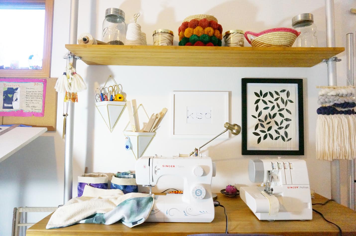 My favorite studio addition is my sewing/serging station. It is such a time saver being able to keep my machines handy all the time. Plus the upper shelf provides additional storage for product supplies, such as zippers.