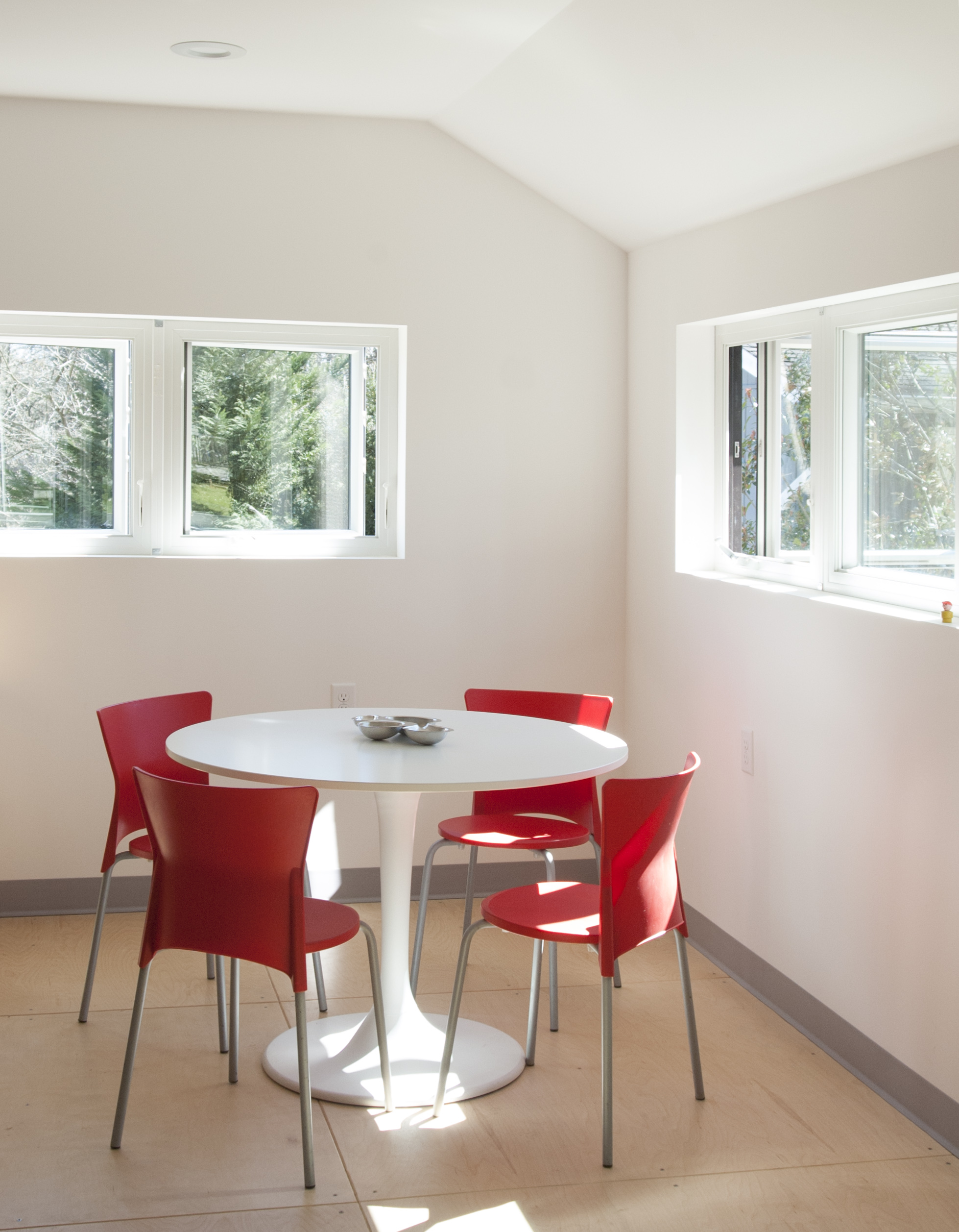 Upstairs feels like a tree house. We can hear the kids play outside but they can’t see us. We set up a meeting table by the windows.