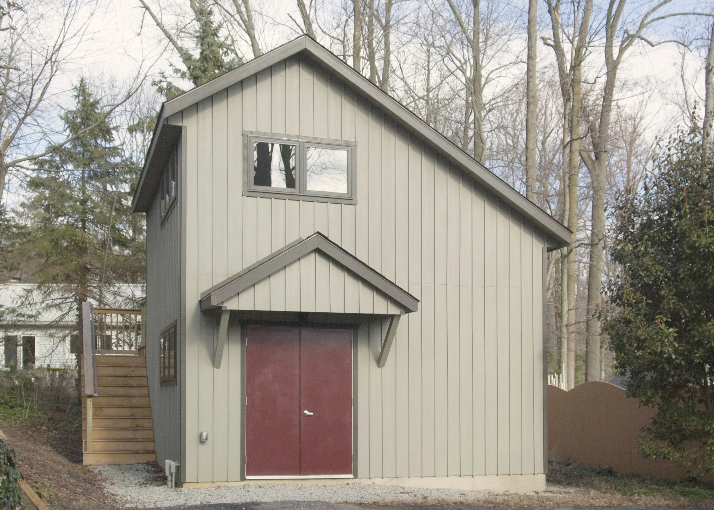 The offset roof line acknowledges the surrounding landscape and allows for more windows on the second floor. The exterior stairs save precious indoor space.