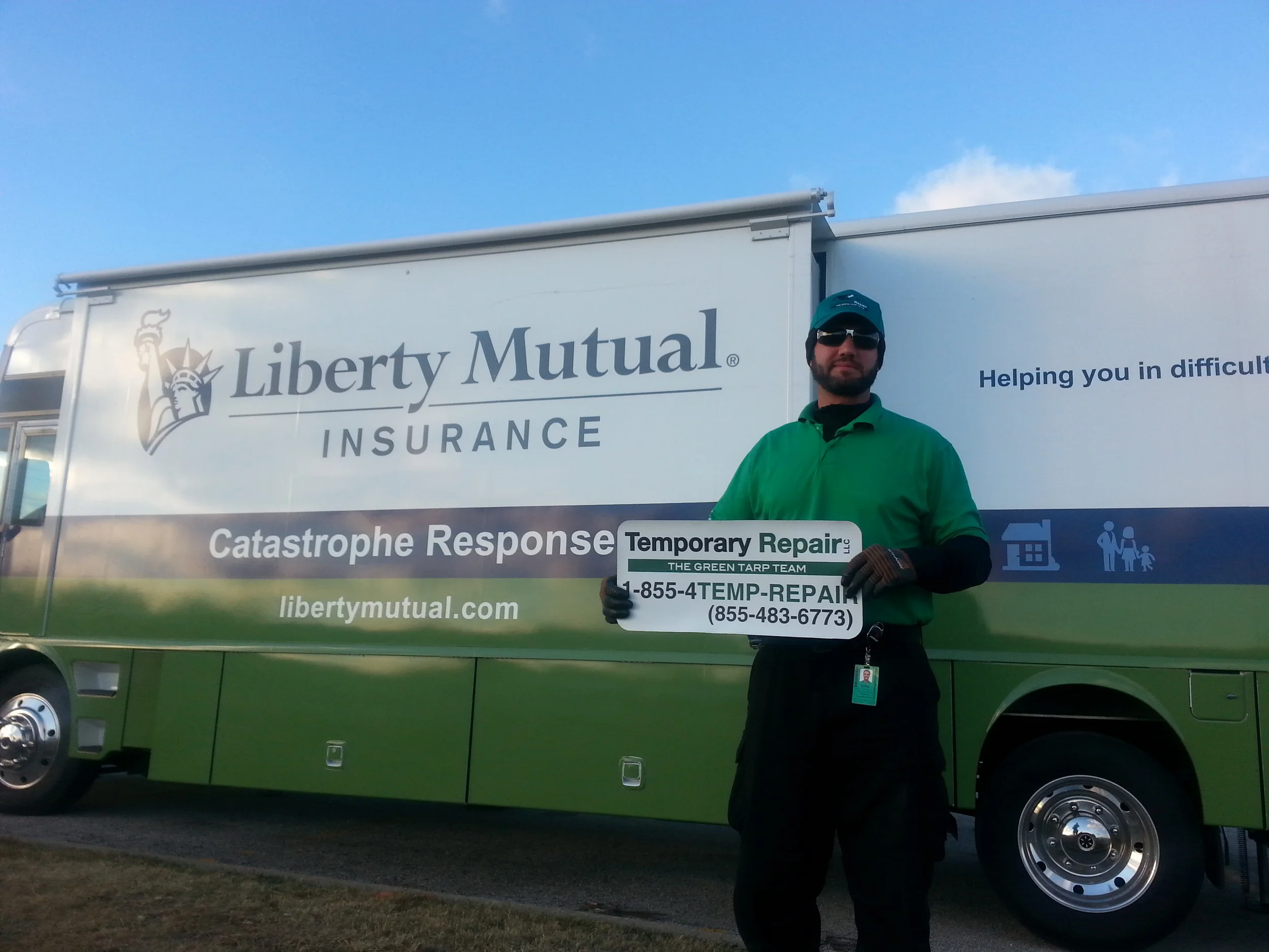 Temporary Repair LLC team member in front of a Liberty Mutual MRU after the Washington, IL tornados
