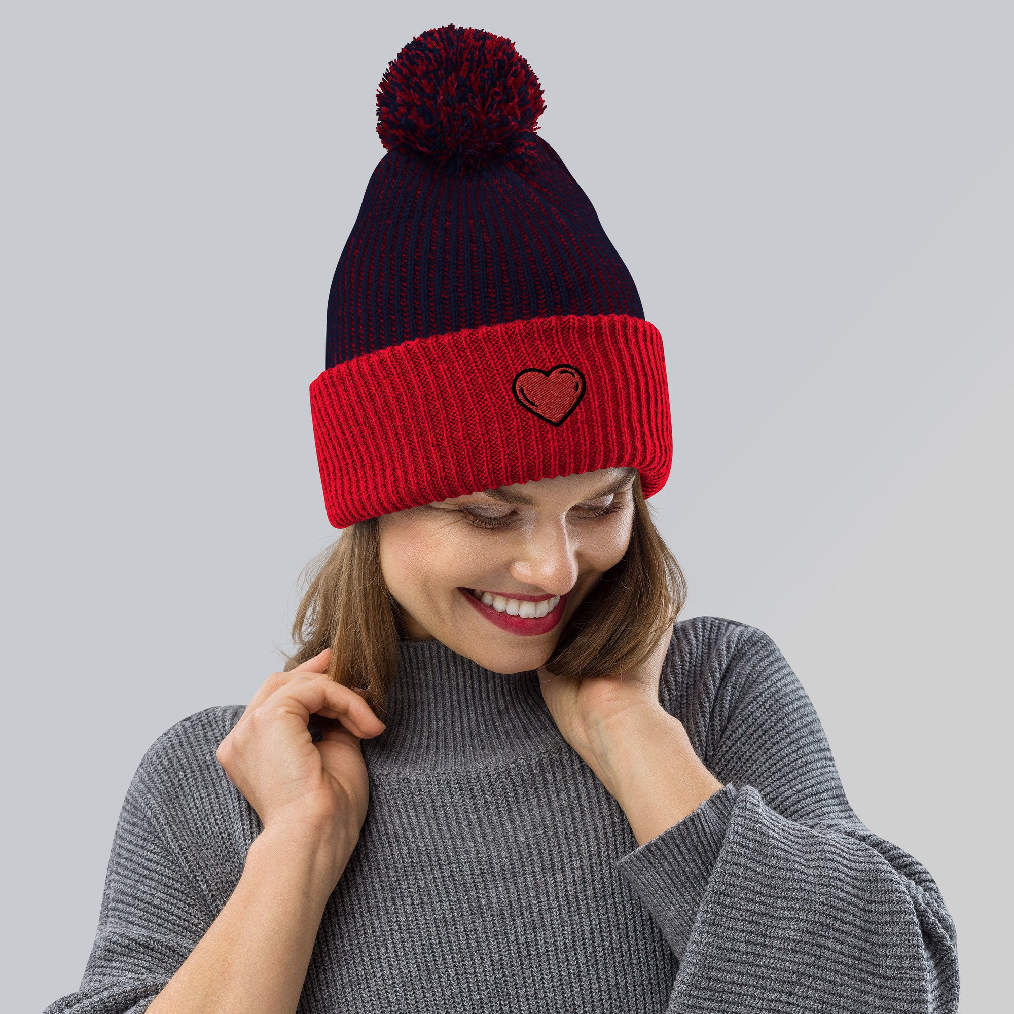 speckled-pom-pom-beanie-navy-red-front-638206e131f6f.jpg