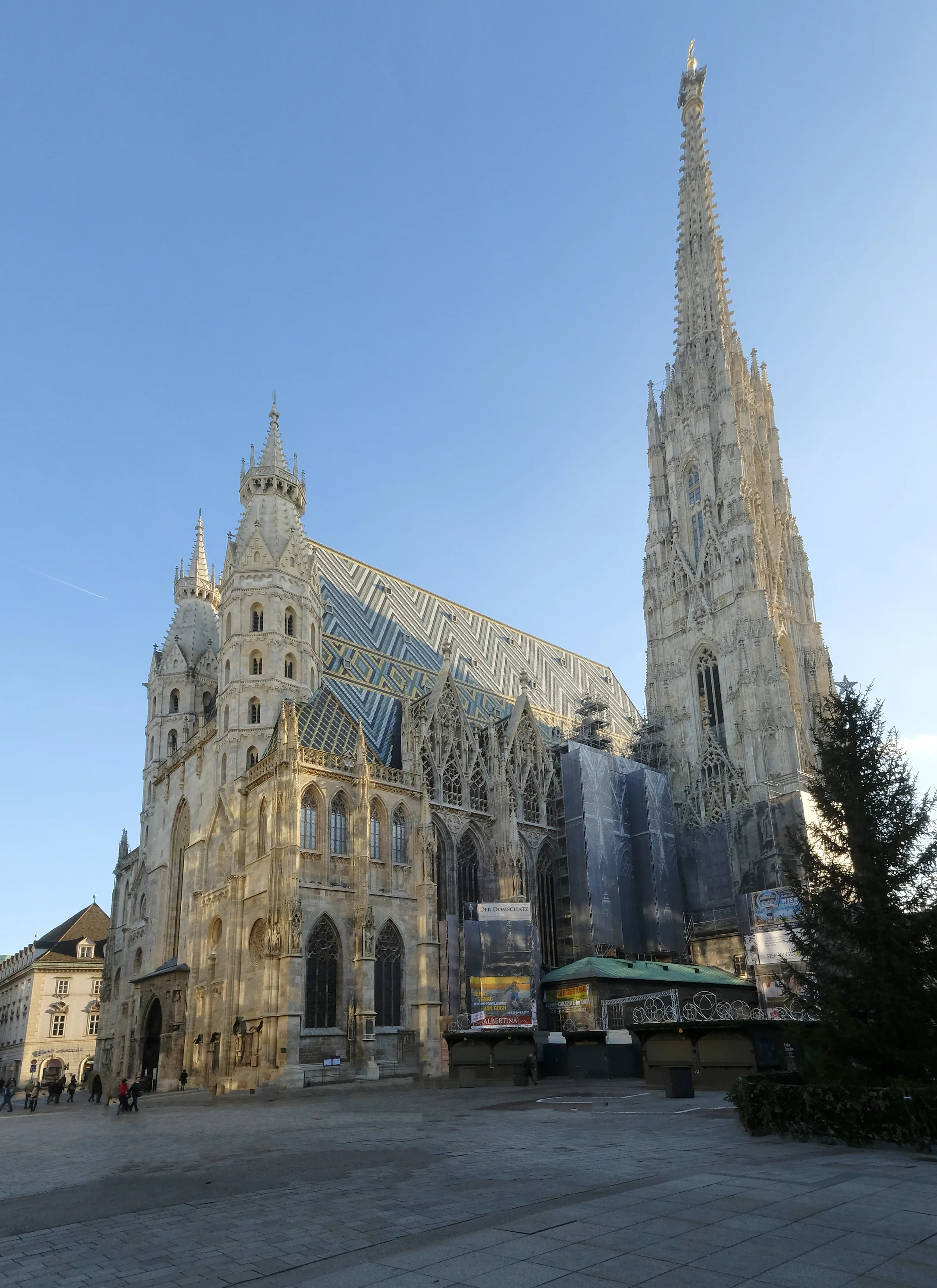 The exterior of St Stephen's church with the Christmas markets surrounding the building.