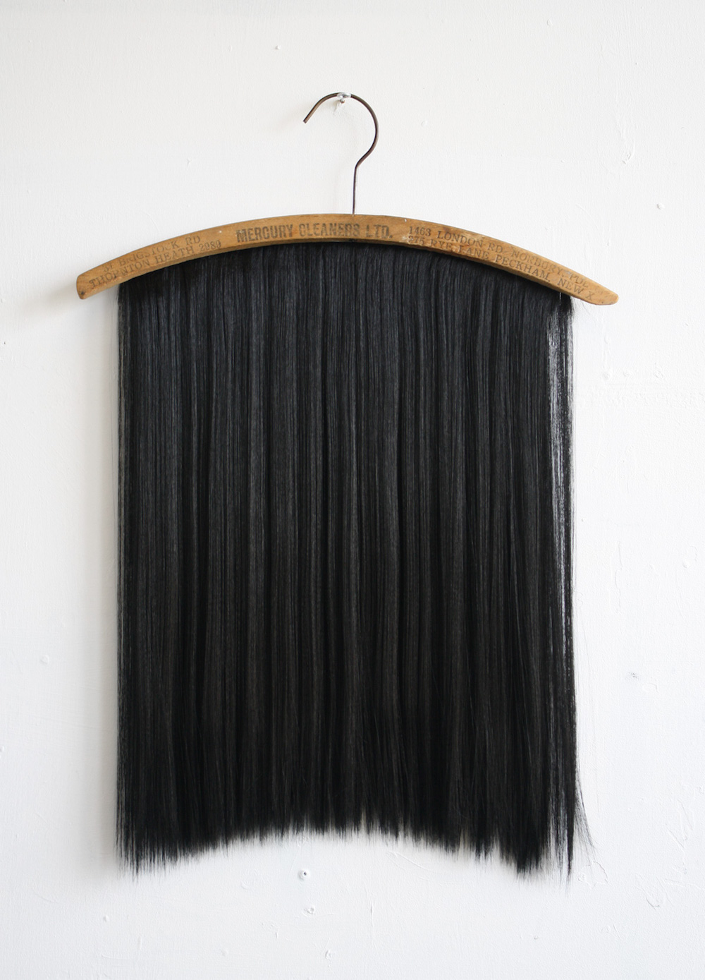  Chaetophobia (Mercury Cleaners LTD Peckham) 43 x 58 cm Found wooden hanger and synthetic hair 2015 