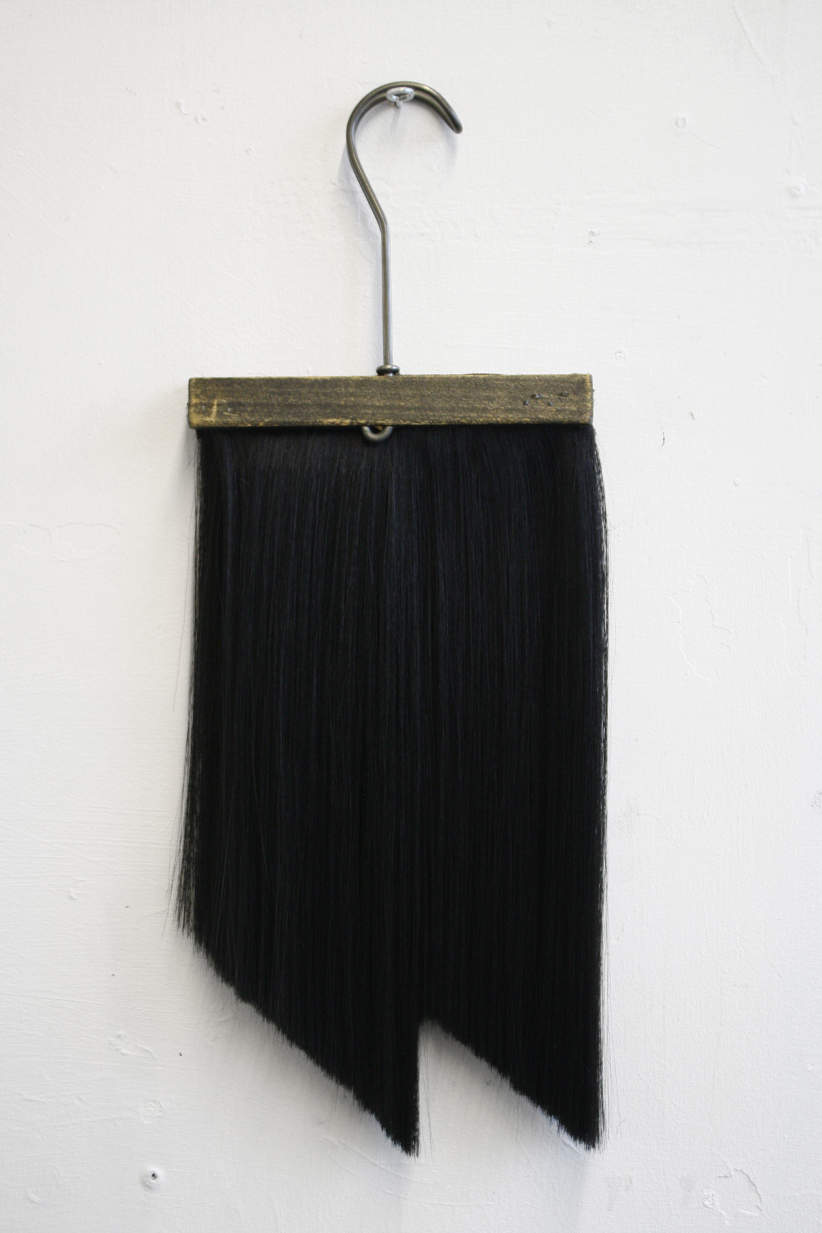  Chaetophobia (Trouser Hanger)&nbsp; 15 x 40 cm wooden hanger and synthetic hair 2015 