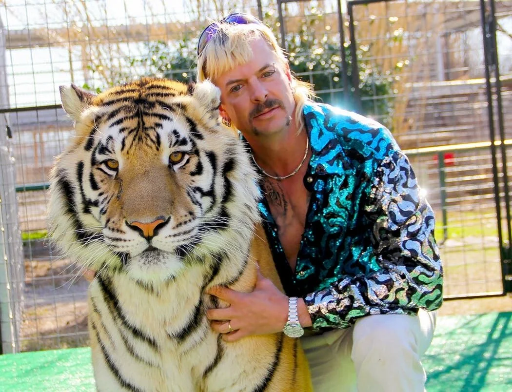 Joe Exotic (right) with Tiger (left) via Netflix