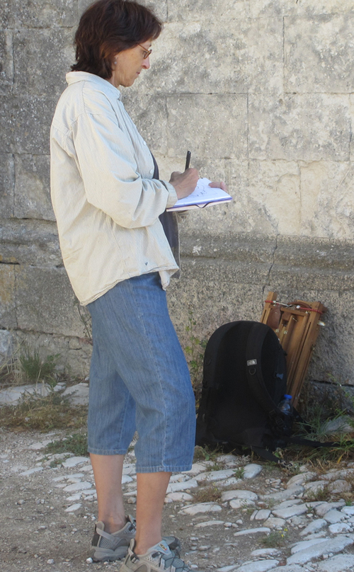 Sketching for a painting with back pack and easel.