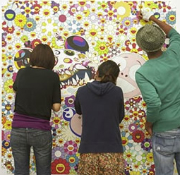 Assistants to Takashi Murakami working on one of his paintings in his New York studio