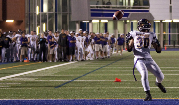 Laurier running back yrel Wilson misses a pass in the end zone during the 2012 season opener with Toronto as the entire team looks on.