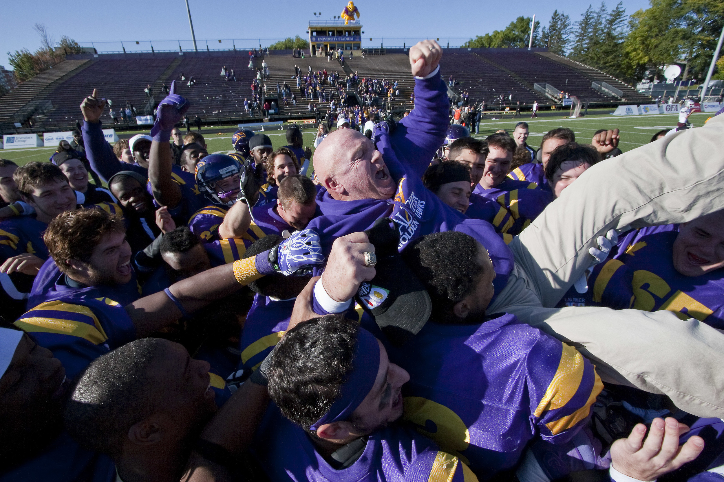 Wilfrid Laurier University football coach Garry Jefferies is hoisted into the air after a homecoming win, October 1, 2011.