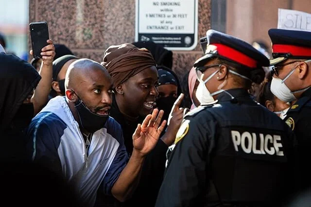 Protesters, one with tears streaming down their face, passionately talk with Toronto police at the #notanotherblacklife protest, Saturday May 30, 2020. If you are looking for a way to be supportive I encourage everyone to donate to organizations like